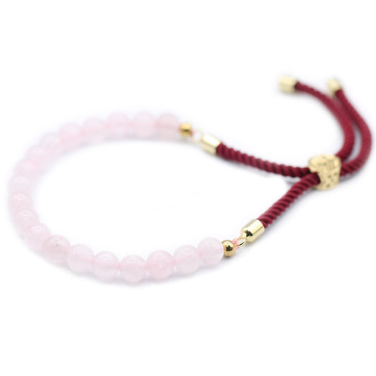Unisex Handcrafted 18K Gold Plated Gemstone Bracelet - Burgundy String / Rose Quartz product packaging on clean background from Quintessential Holistic Health Ltd
