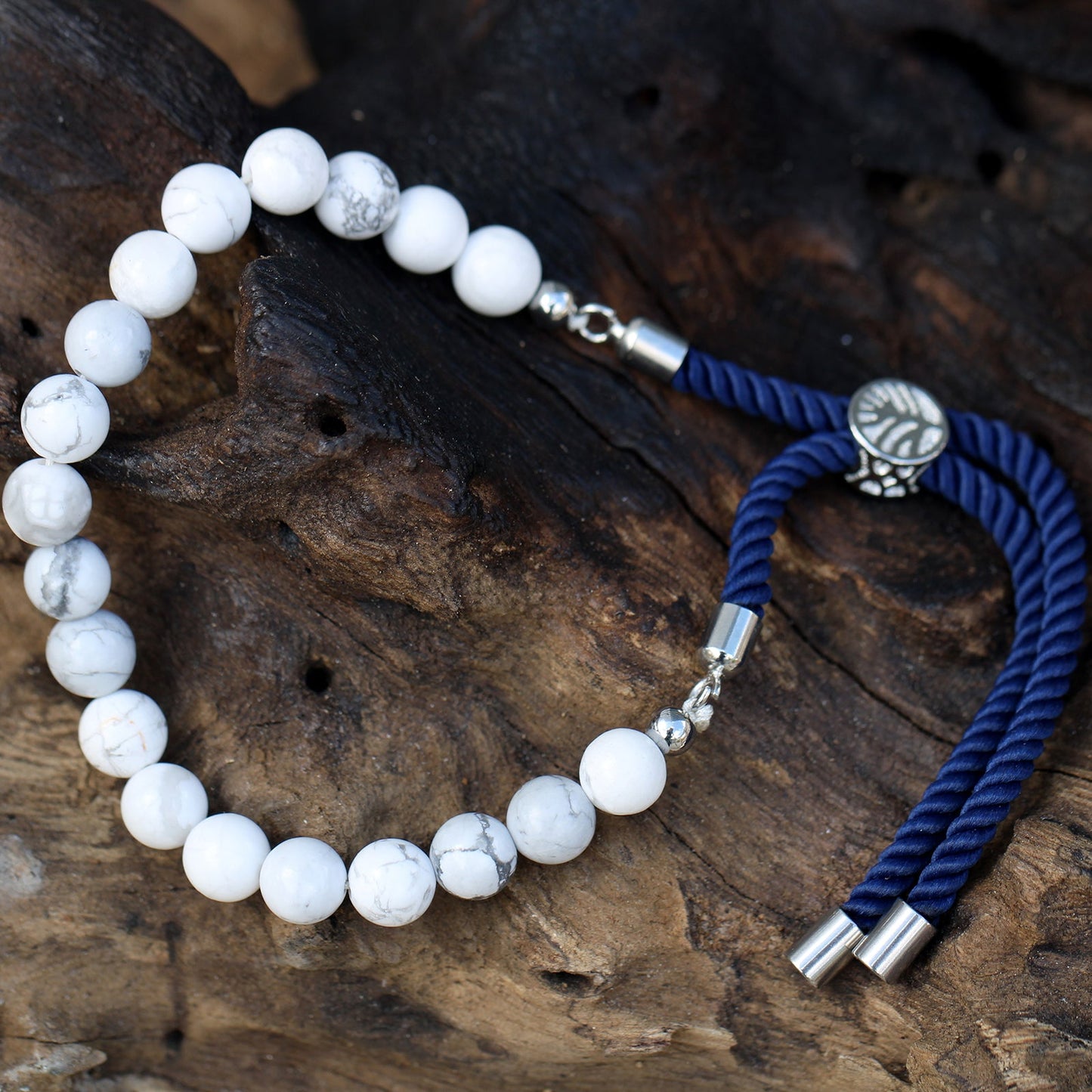 Unisex Handcrafted 925 Silver Plated Gemstone Bracelet - Navy Blue String / White Howlite product packaging on clean background from Quintessential Holistic Health Ltd