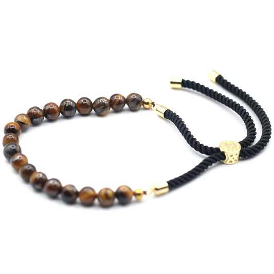 Unisex Handcrafted 18K Gold Plated Gemstone Bracelet - Black String / Tigers Eye product packaging on clean background from Quintessential Holistic Health Ltd