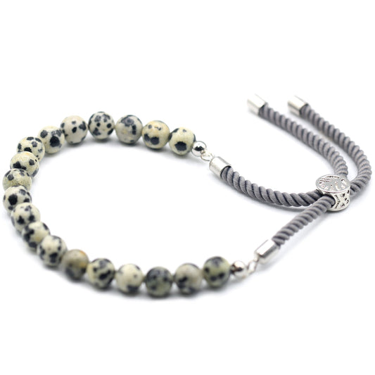 Unisex Handcrafted 925 Silver Plated Gemstone Bracelet - Charcoal String / Dalmatian Jasper product packaging on clean background from Quintessential Holistic Health Ltd