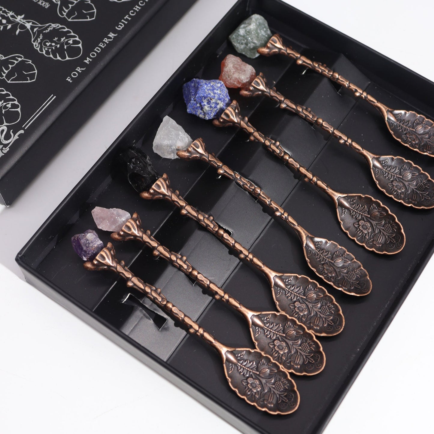 Set of 7 Gemstone Crystal Witches Spoons - Bronze product packaging on clean background from Quintessential Holistic Health Ltd
