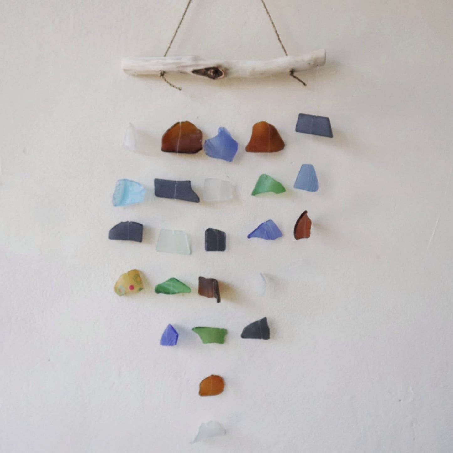 Handmade Driftwood and Recycled Glass Wind Chime - Five Drop / Multicoloured product packaging on clean background from Quintessential Holistic Health Ltd