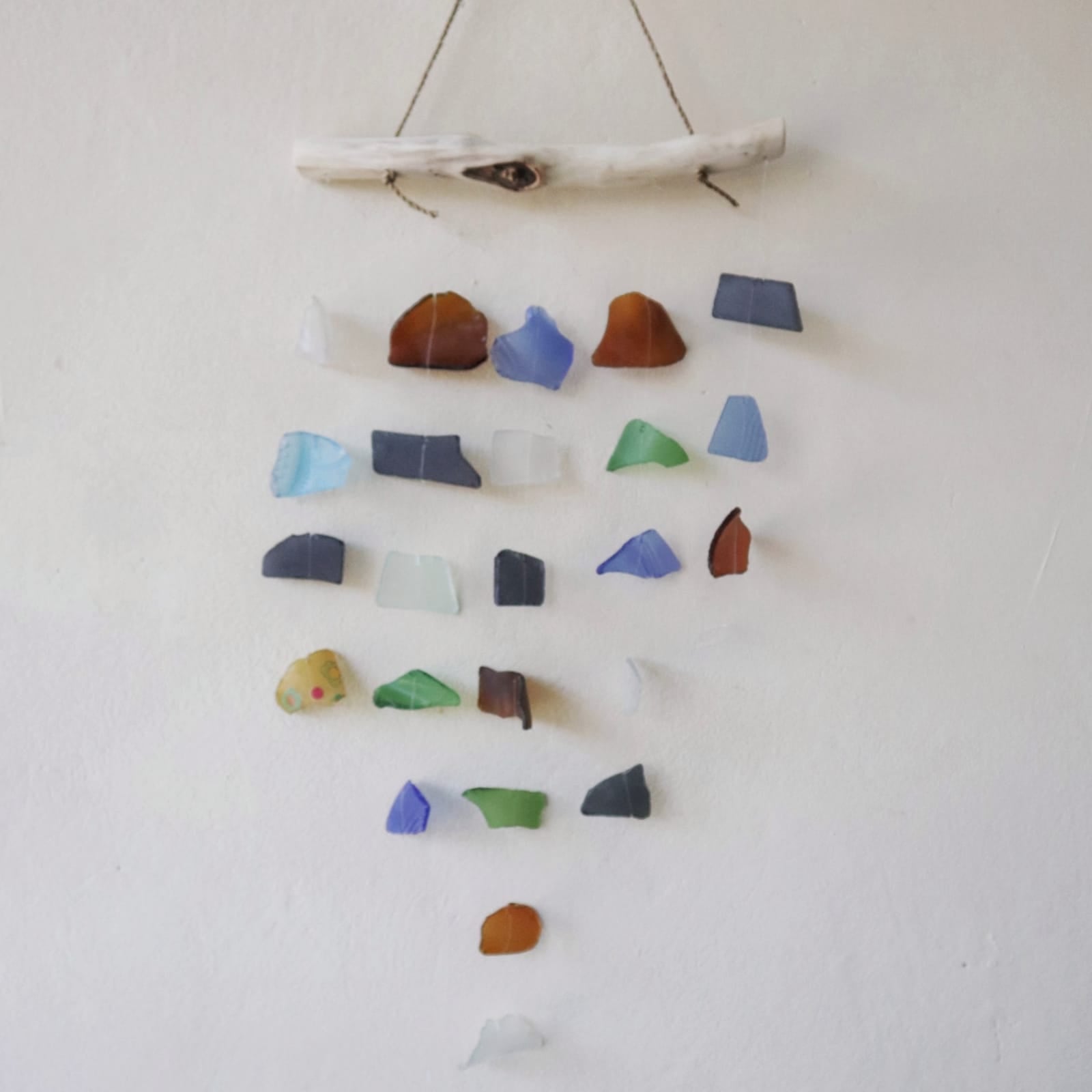 Handmade Driftwood and Recycled Glass Wind Chime - Five Drop / Multicoloured product packaging on clean background from Quintessential Holistic Health Ltd