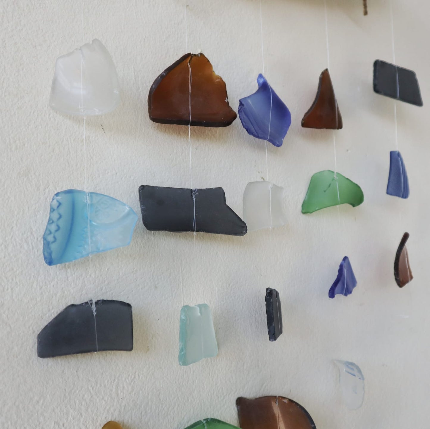 Handmade Driftwood and Recycled Glass Wind Chime - Five Drop / Multicoloured product packaging on clean background from Quintessential Holistic Health Ltd