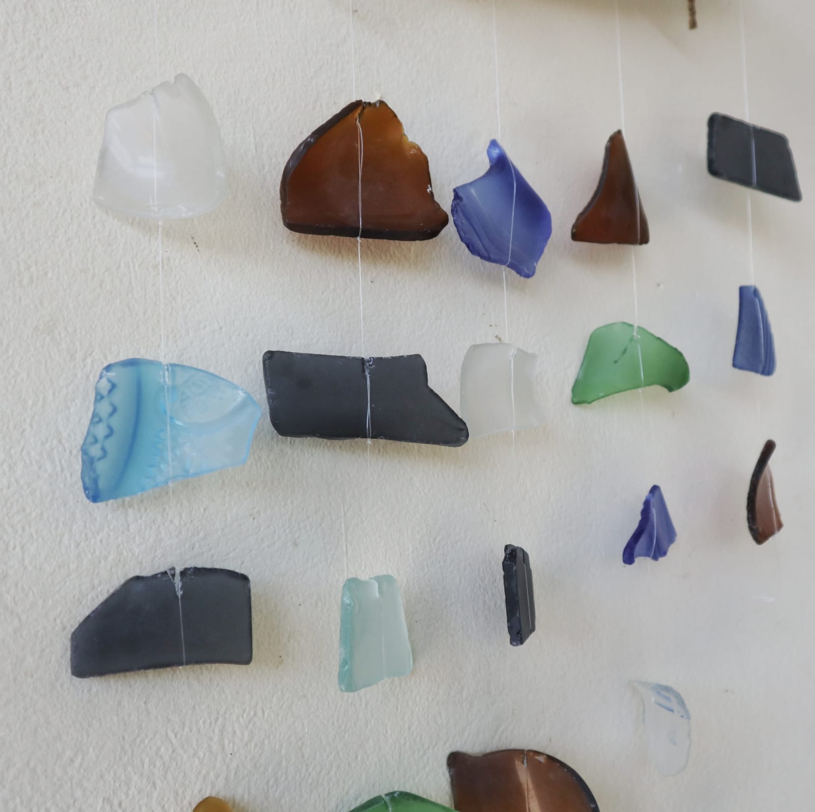 Handmade Driftwood and Recycled Glass Wind Chime - Five Drop / Multicoloured product packaging on clean background from Quintessential Holistic Health Ltd