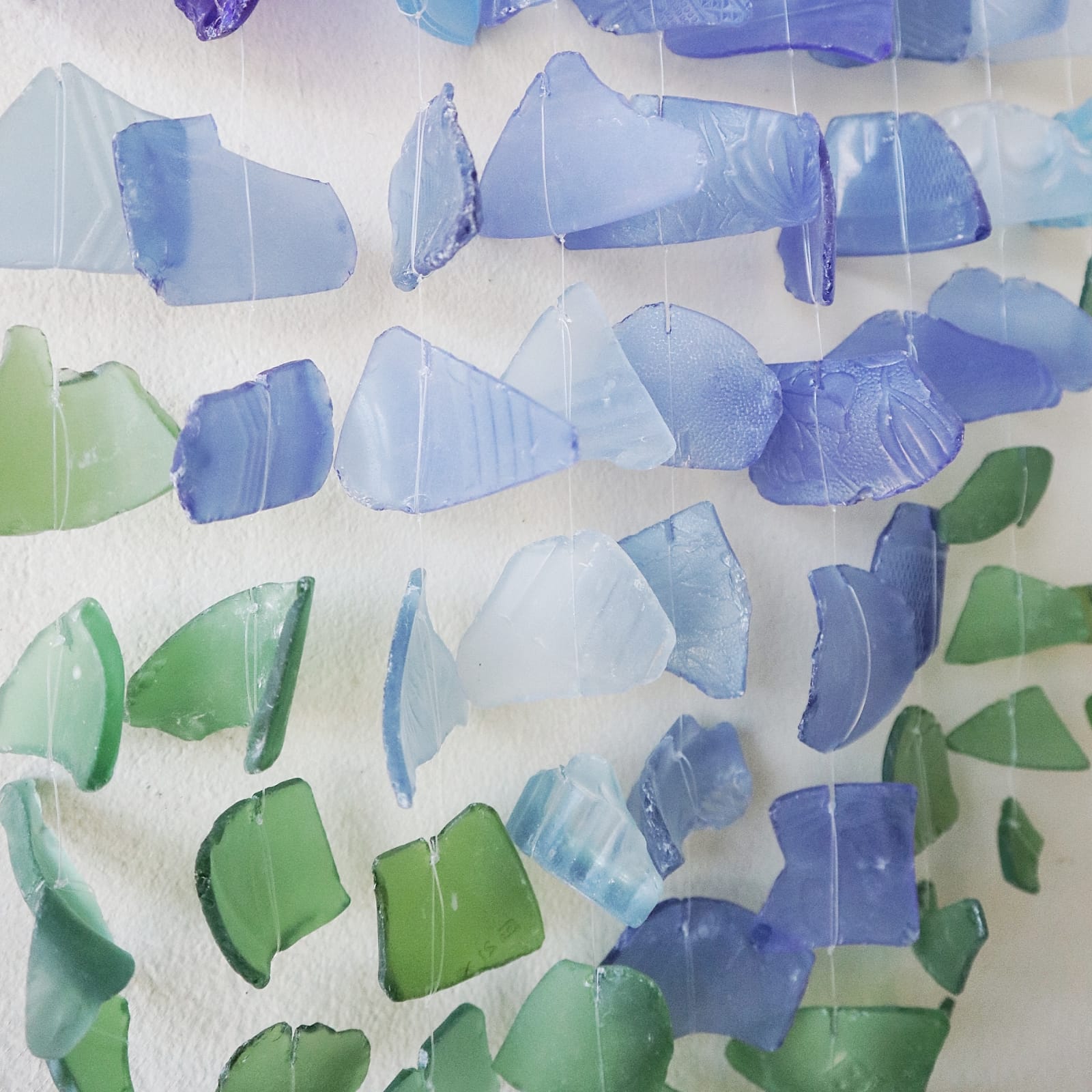 Handmade Driftwood and Recycled Glass Wind Chime - Three Stick / Blue and Green product packaging on clean background from Quintessential Holistic Health Ltd