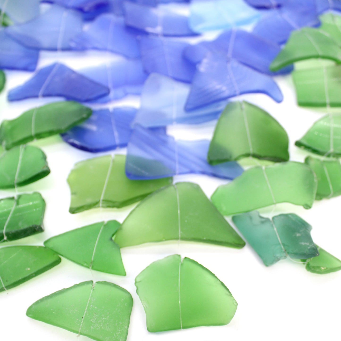 Handmade Driftwood and Recycled Glass Wind Chime - Three Stick / Blue and Green product packaging on clean background from Quintessential Holistic Health Ltd