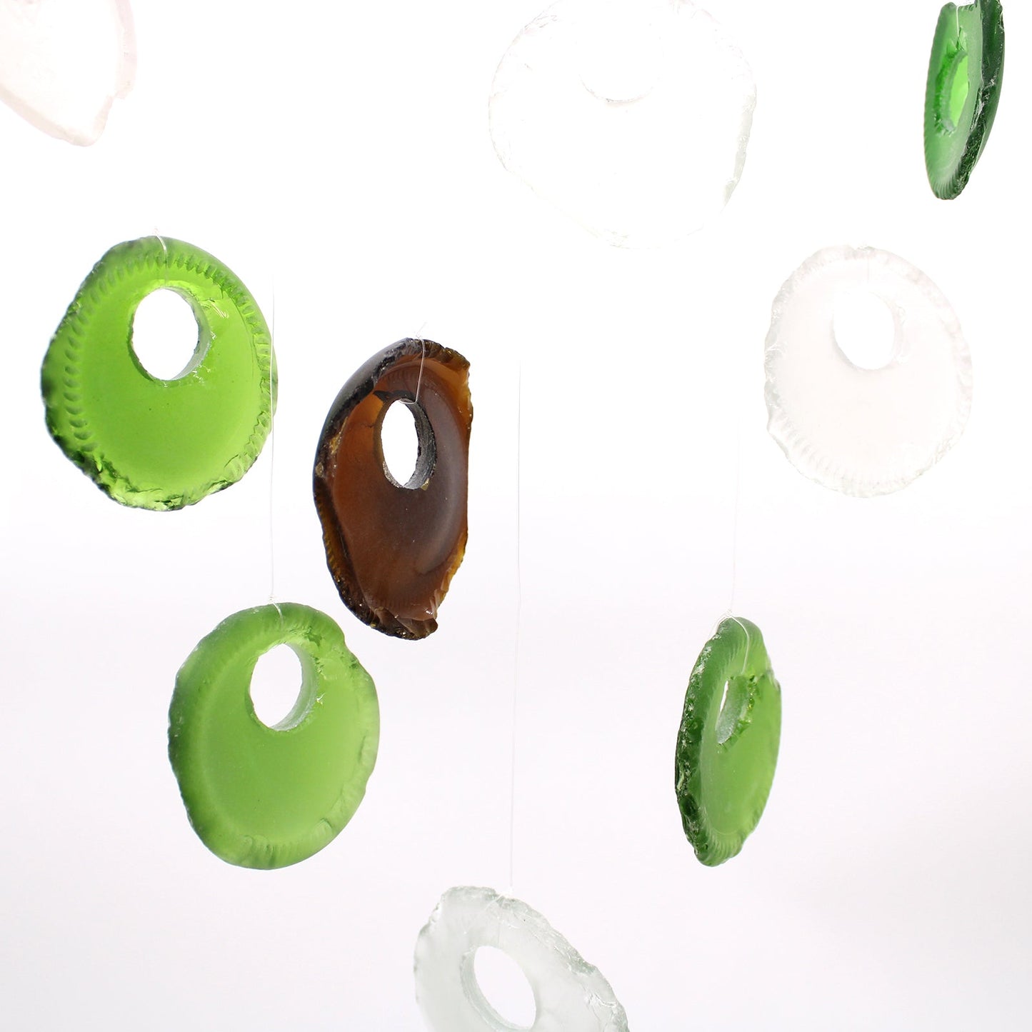 Handmade Driftwood and Recycled Glass Wind Chime - Bottle Bottoms / Multicoloured product packaging on clean background from Quintessential Holistic Health Ltd