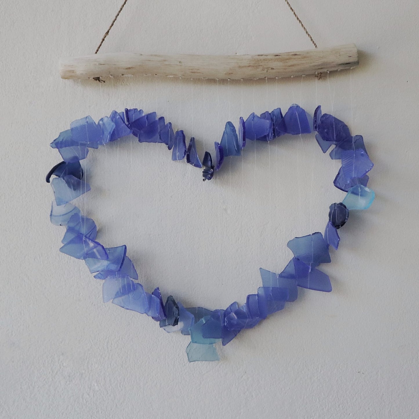 Handmade Driftwood and Recycled Glass Wind Chime - Loving Heart / Blue product packaging on clean background from Quintessential Holistic Health Ltd