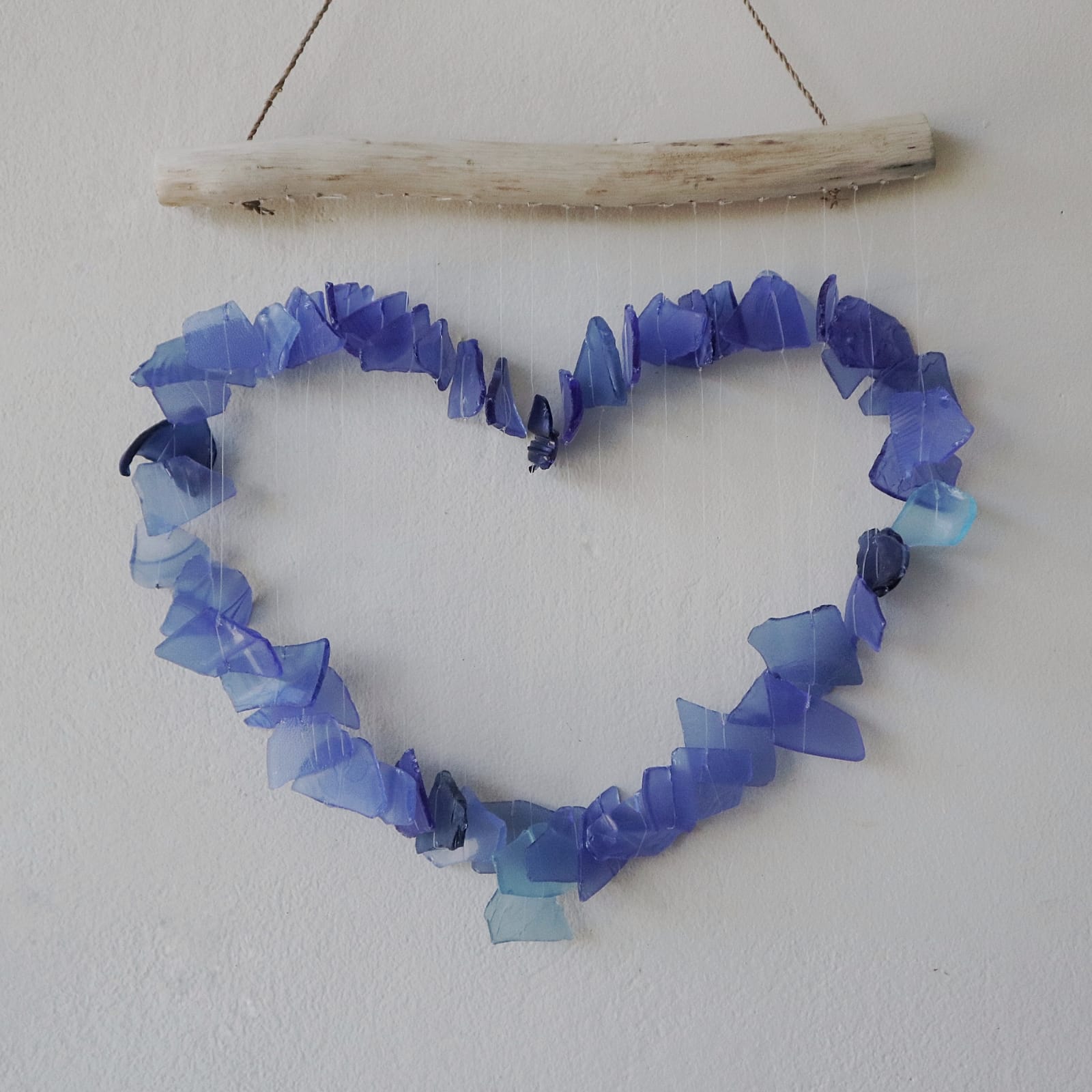 Handmade Driftwood and Recycled Glass Wind Chime - Loving Heart / Blue product packaging on clean background from Quintessential Holistic Health Ltd