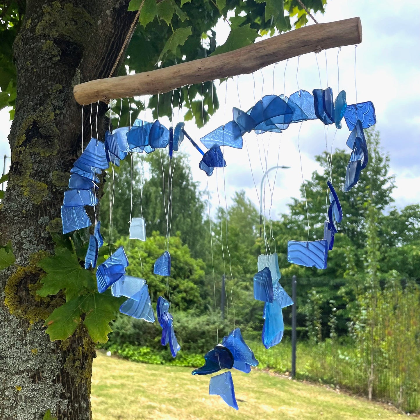 Handmade Driftwood and Recycled Glass Wind Chime - Loving Heart / Blue product packaging on clean background from Quintessential Holistic Health Ltd