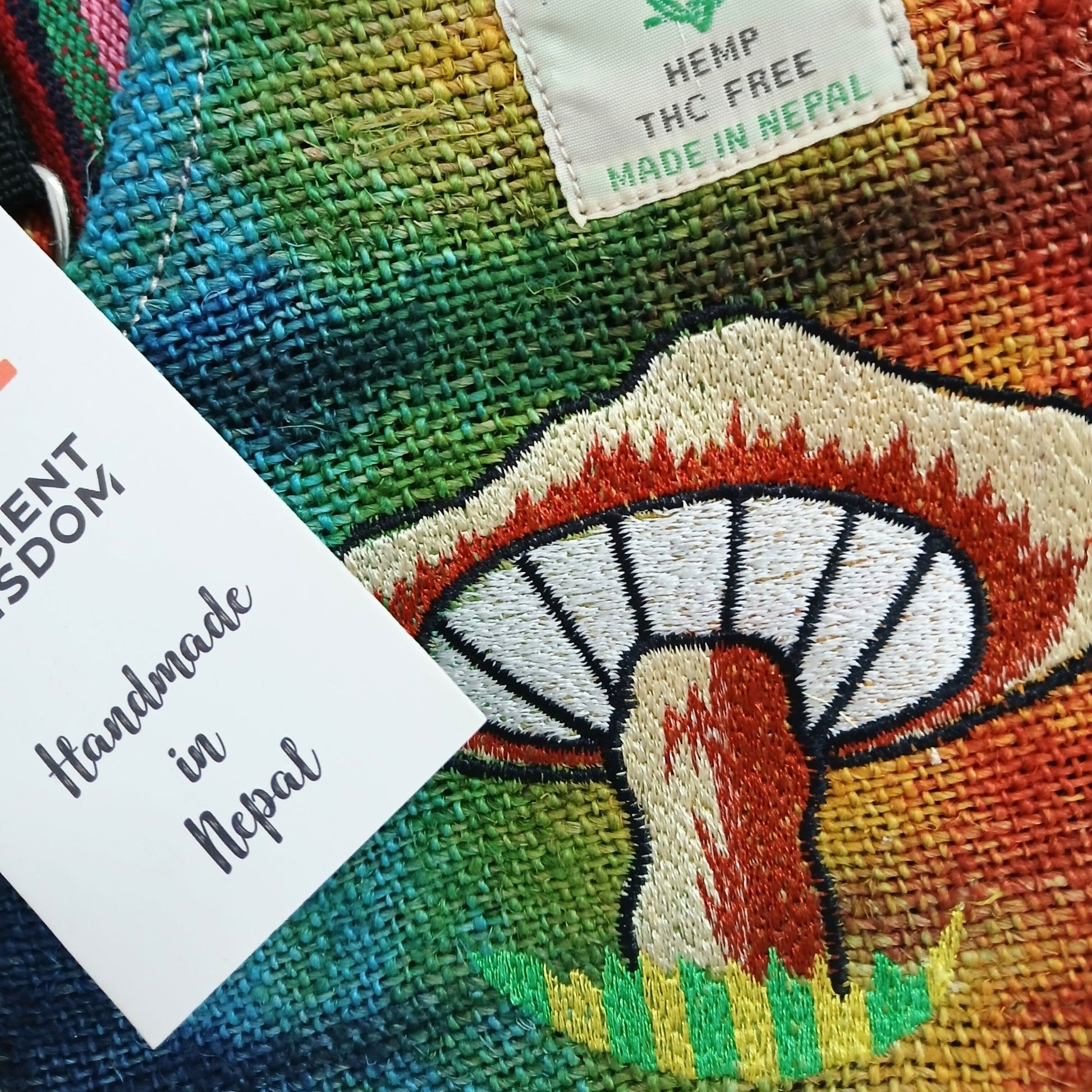 Eco-Friendly Hemp and Cotton Embroidered Bag - Orange / Mushroom product packaging on clean background from Quintessential Holistic Health Ltd