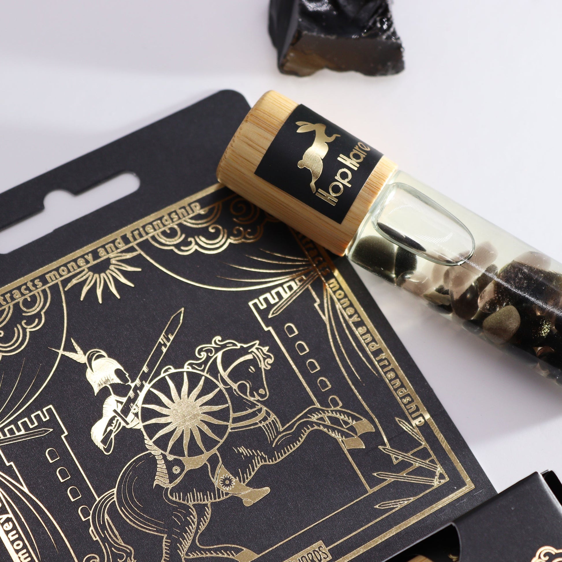 Gemstone Tarot Essential Oil Roll On - Black Tourmaline / The Knight product packaging on clean background from Quintessential Holistic Health Ltd