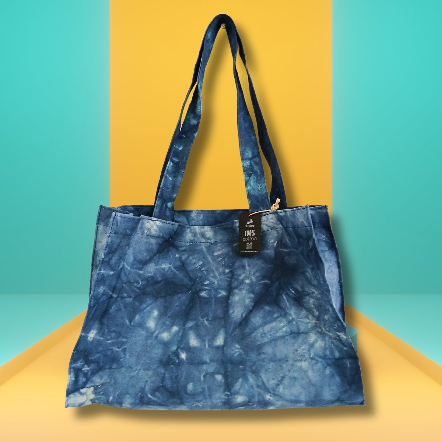 Handmade 100% Natural Cotton Handy Bag - Deep Sea Blue Stonewash, mottled blue bag with a black hanging tag, by Quintessential Holistic Health Ltd