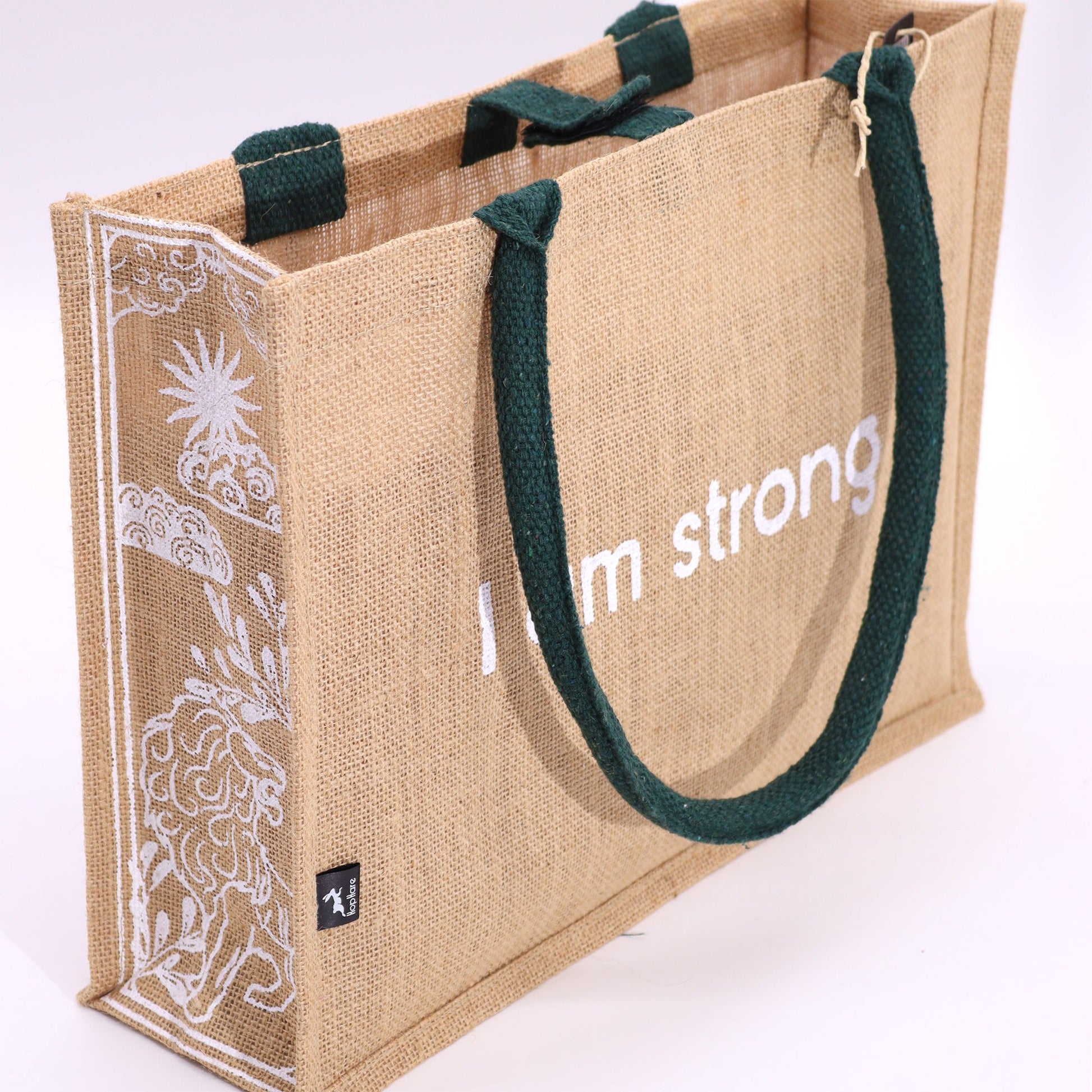 Eco-Friendly Jute Tote Bag - I Am Strong, a tan bag with dark green trim, white affirmation text and a decorative side panel by Quintessential Holistic Health Ltd