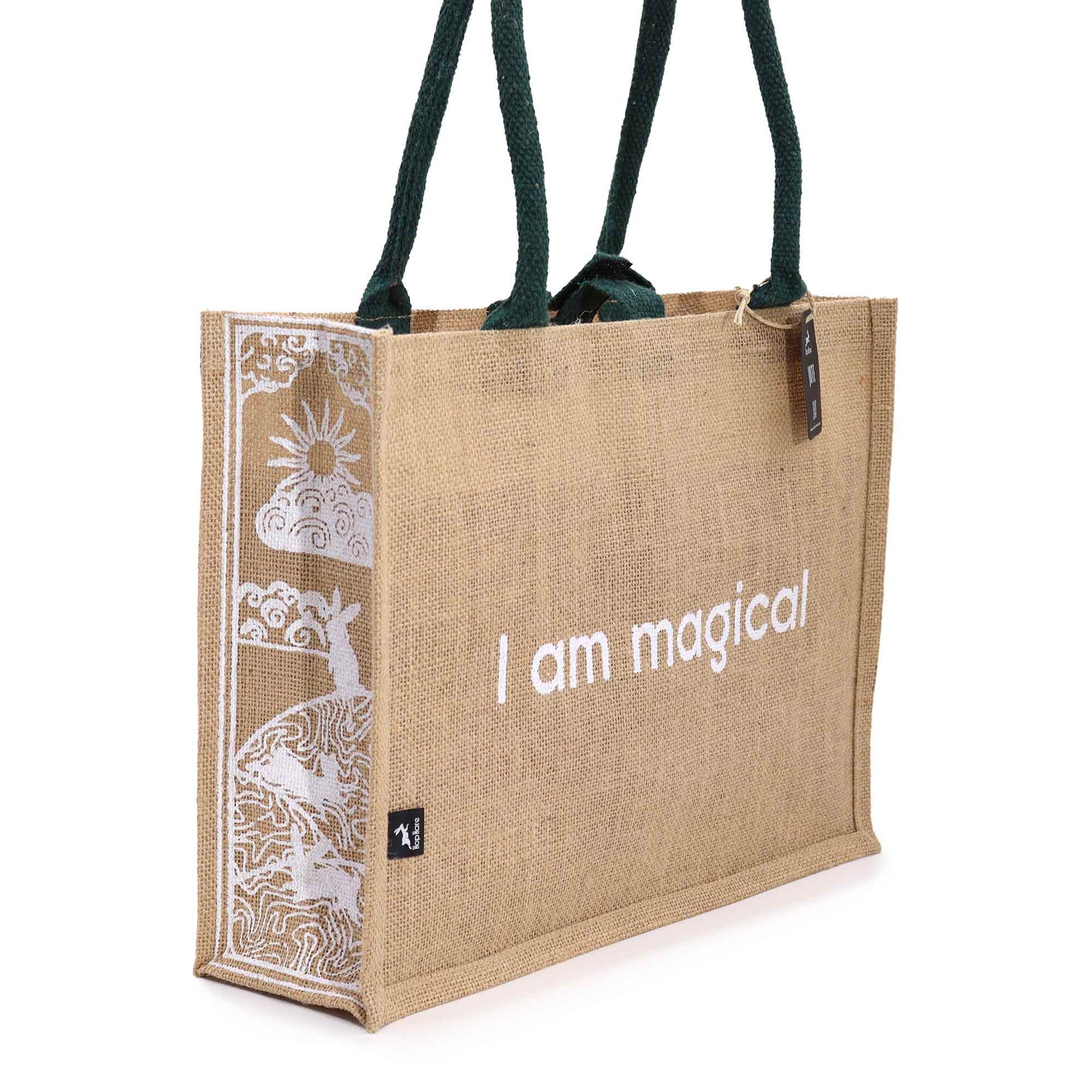 Eco-Friendly Jute Tote Bag - I Am Magical, with white affirmation text and sun-and-lion side artwork by Quintessential Holistic Health Ltd