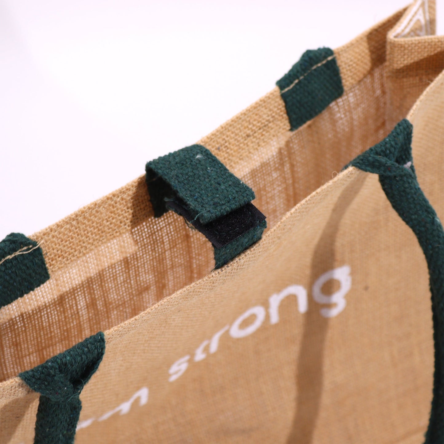 Eco-Friendly Jute Tote Bag - I Am Bright, with close-up dark green fastening tabs and partially visible white text by Quintessential Holistic Health Ltd
