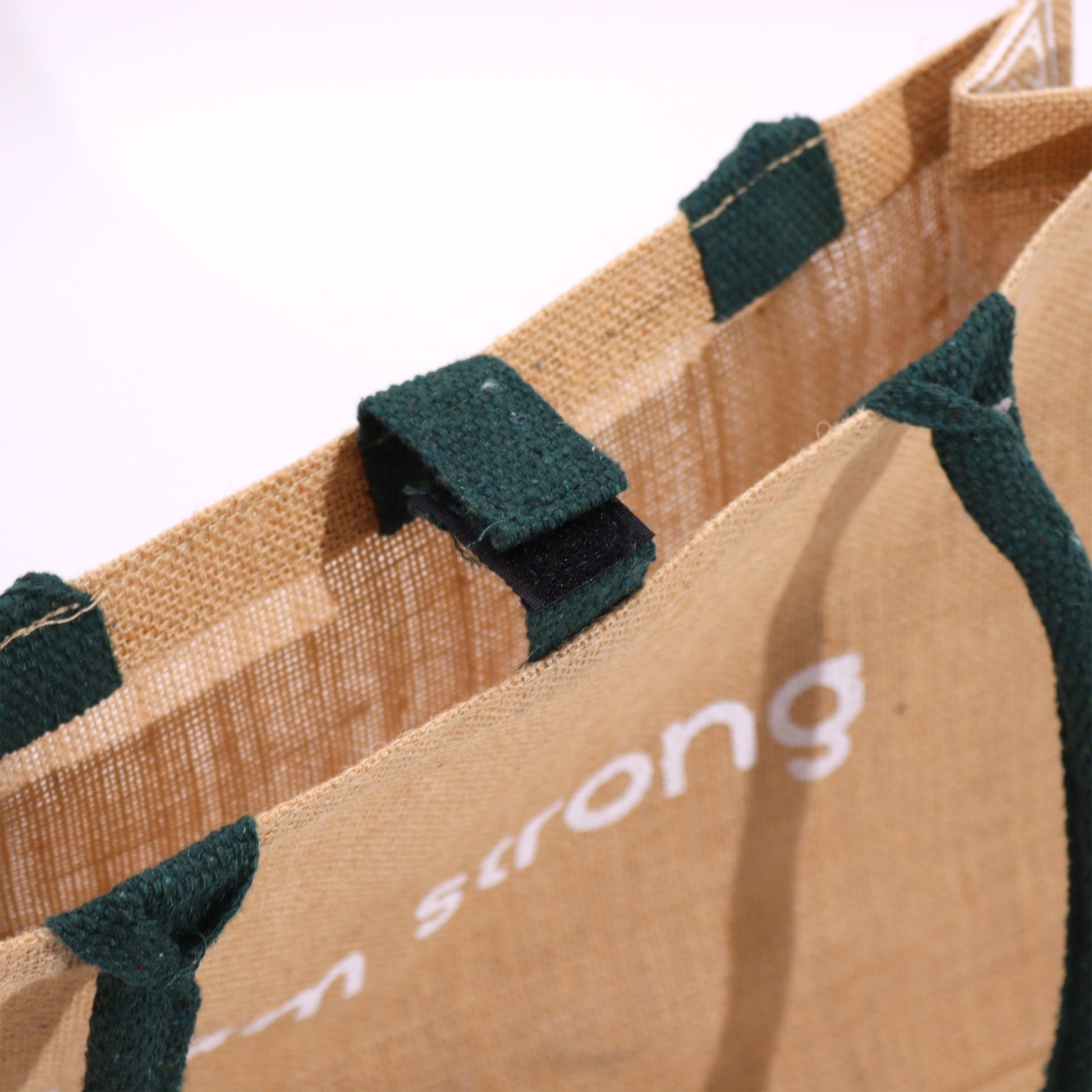 Eco-Friendly Jute Tote Bag - I Am Bright, with close-up dark green fastening tabs and partially visible white text by Quintessential Holistic Health Ltd