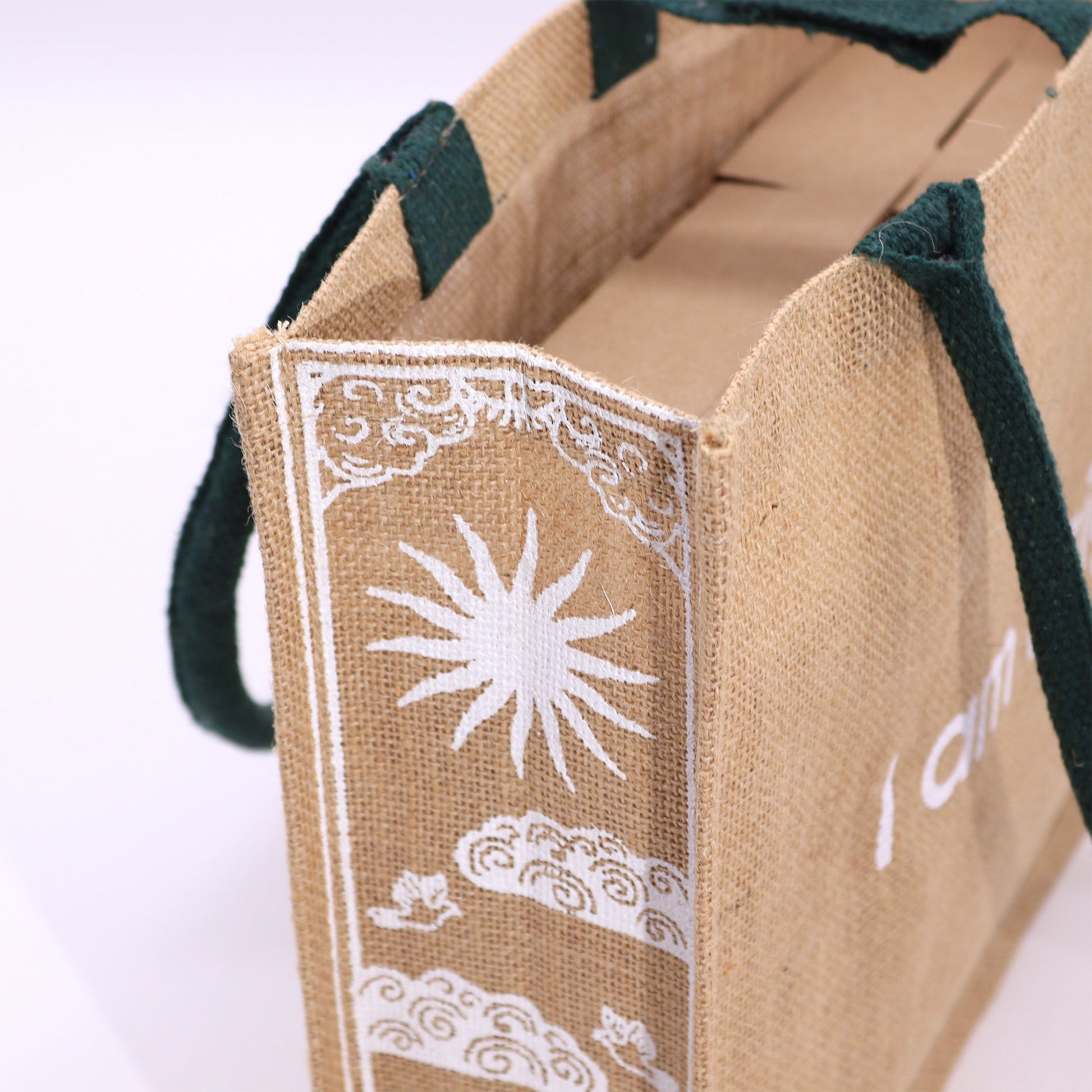 Eco-Friendly Jute Tote Bag - I Am Bright, with close-up white sun and cloud artwork on the side panel by Quintessential Holistic Health Ltd
