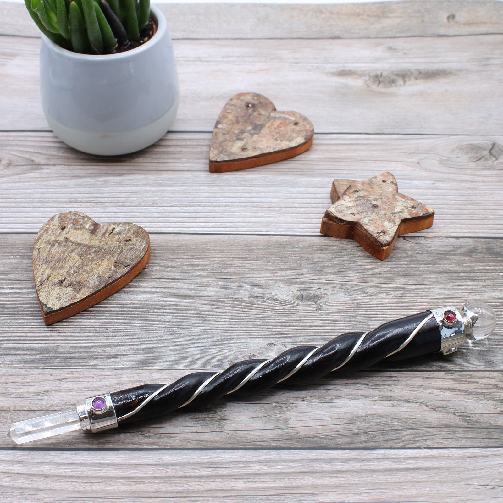 Handmade Twisted Teak Wooden Healing Wand - Silver Rock Quartz Gemstone product packaging on clean background from Quintessential Holistic Health Ltd
