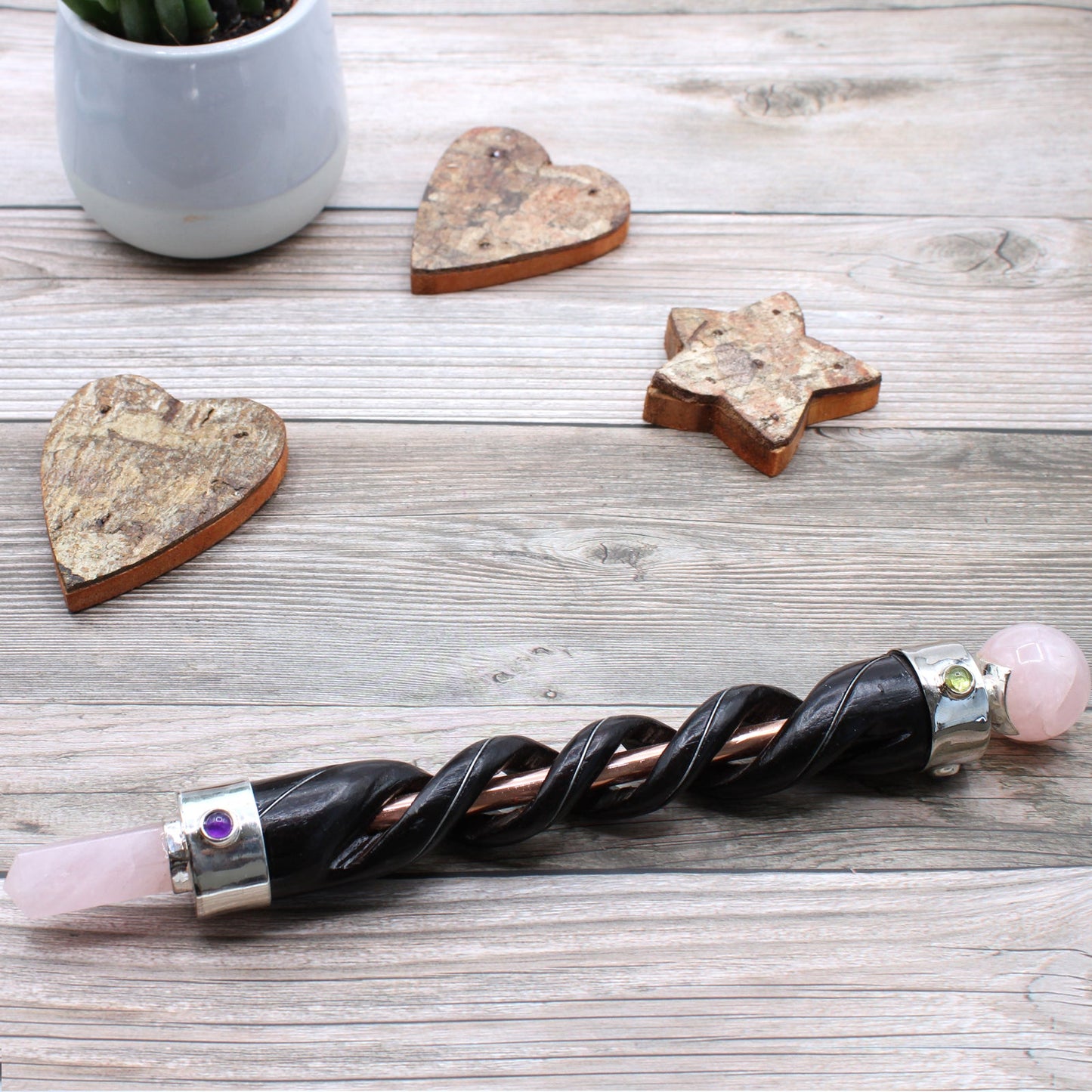Handmade Spiral Teak Wooden Healing Wand with Copper - Rose Quartz Gemstones product packaging on clean background from Quintessential Holistic Health Ltd