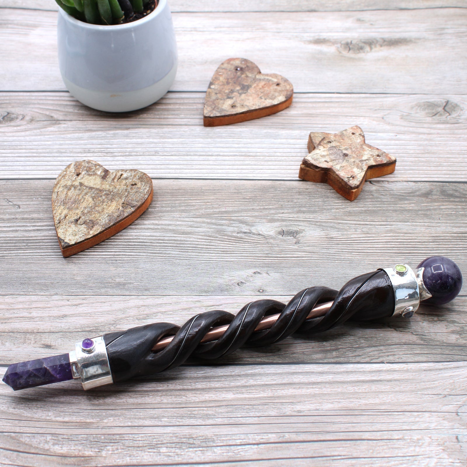 Handmade Spiral Teak Wooden Healing Wand with Copper - Amethyst Gemstone product packaging on clean background from Quintessential Holistic Health Ltd