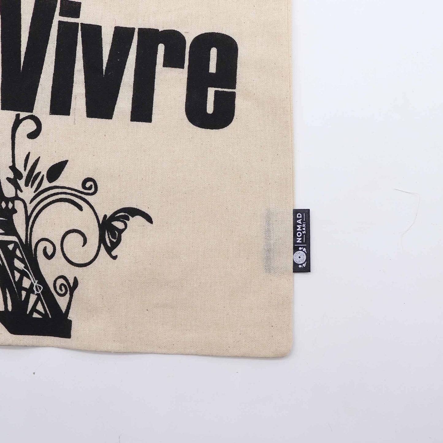 Iconic Natural Cotton Tote Bag - Joie de Vivre - Natural, close-up of Vivre lettering, floral scrollwork and side label by Quintessential Holistic Health Ltd
