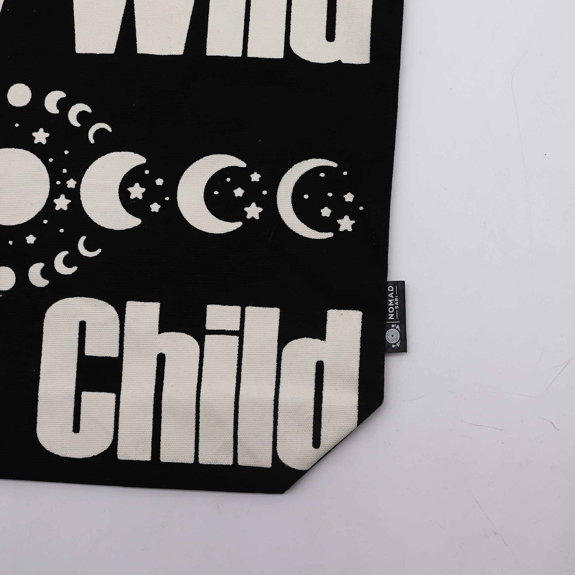 Cotton Classic Tote Bag - Stay Wild, Mood Child - Black & Natural, close-up of moon phases, stars, Child text, lower corner and side label by Quintessential Holistic Health Ltd