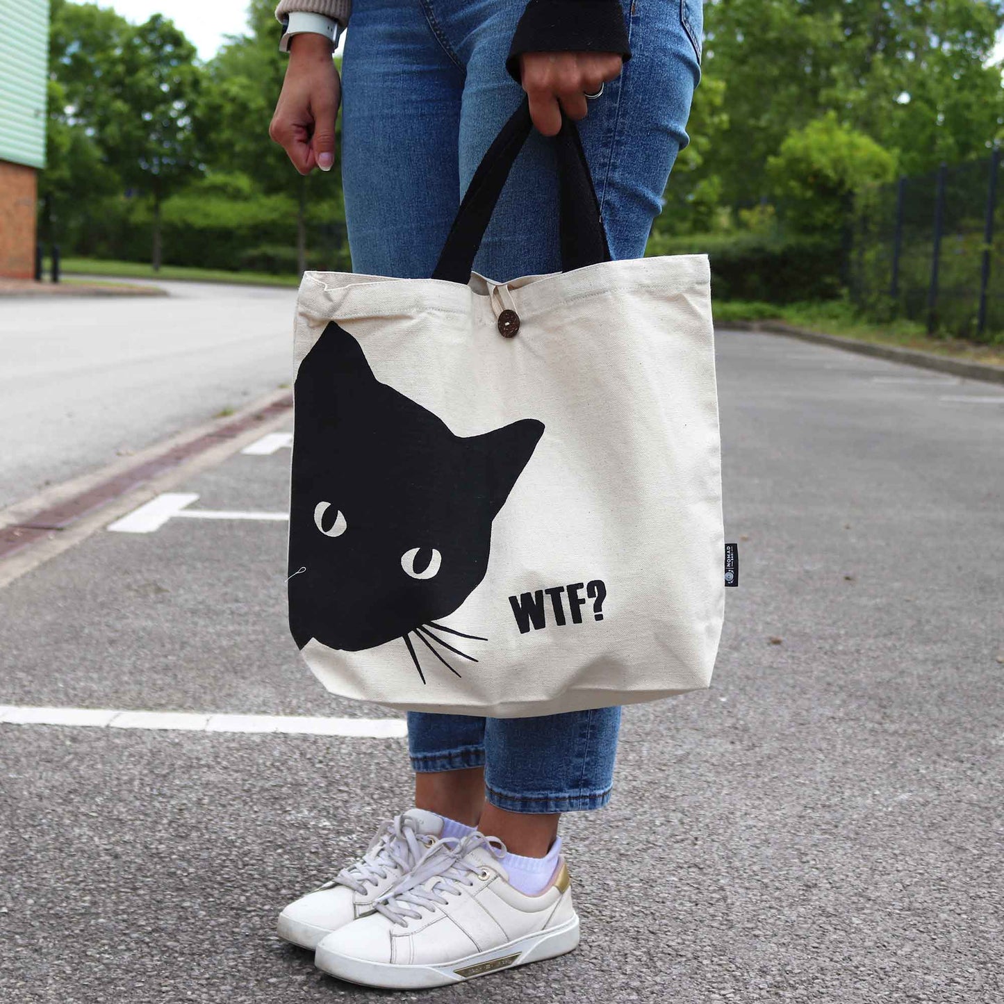 Iconic Cotton Classic Tote Bag - WTF Black Cat - Natural, carried outdoors with a large black cat face and WTF? text by Quintessential Holistic Health Ltd