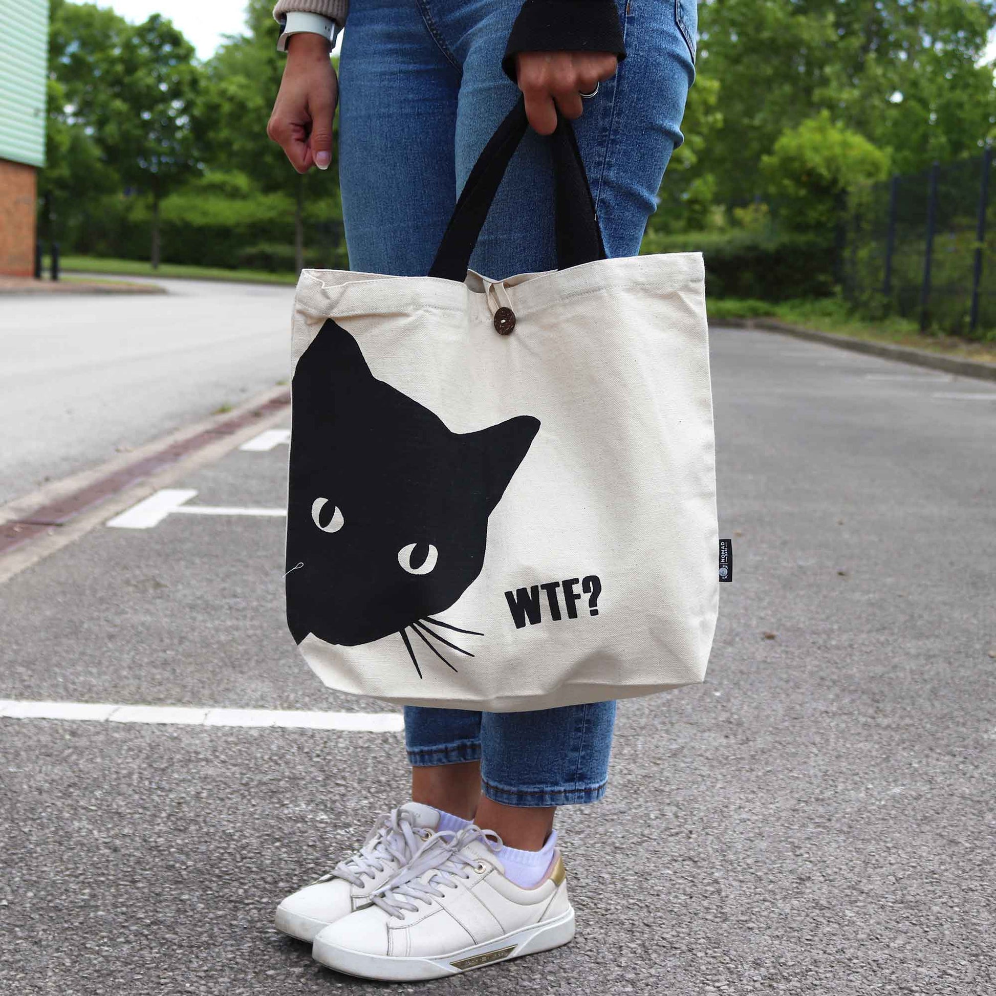 Iconic Cotton Classic Tote Bag - WTF Black Cat - Natural, carried outdoors with a large black cat face and WTF? text by Quintessential Holistic Health Ltd