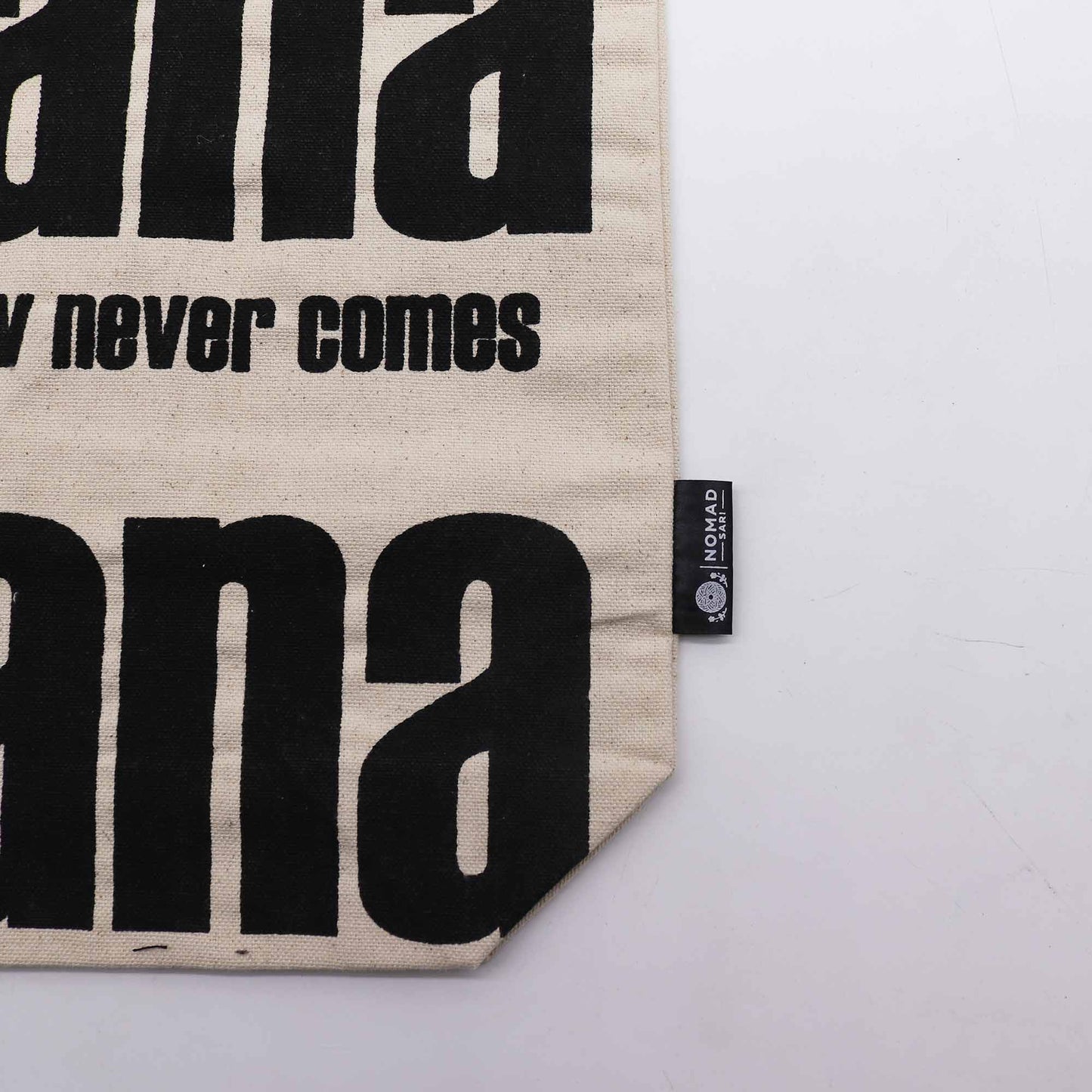 Iconic Cotton Classic Tote Bag - Mañana Mañana - Natural, close-up of lower black lettering, slogan text, corner and side label by Quintessential Holistic Health Ltd