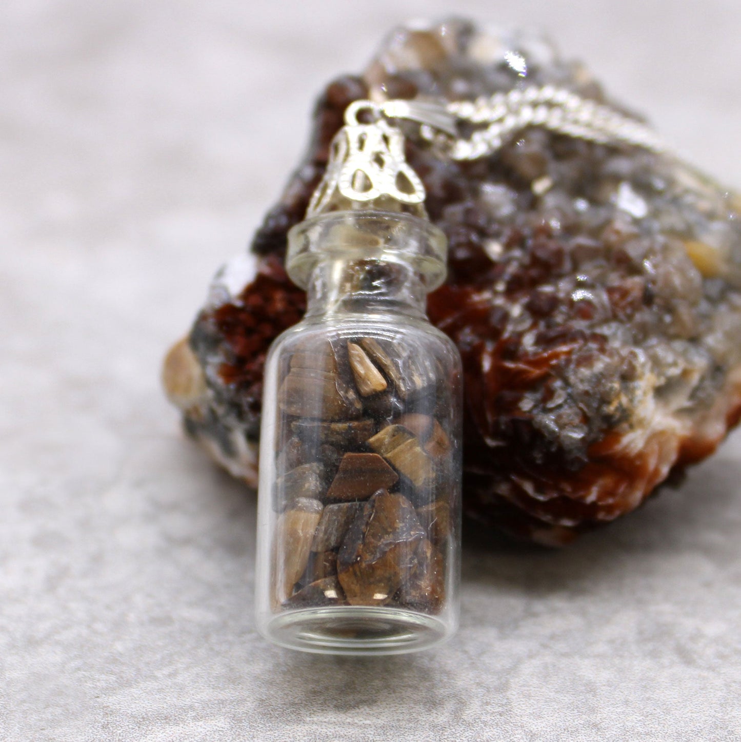 Bottled Gemstones Necklace - Amethyst product packaging on clean background from Quintessential Holistic Health Ltd
