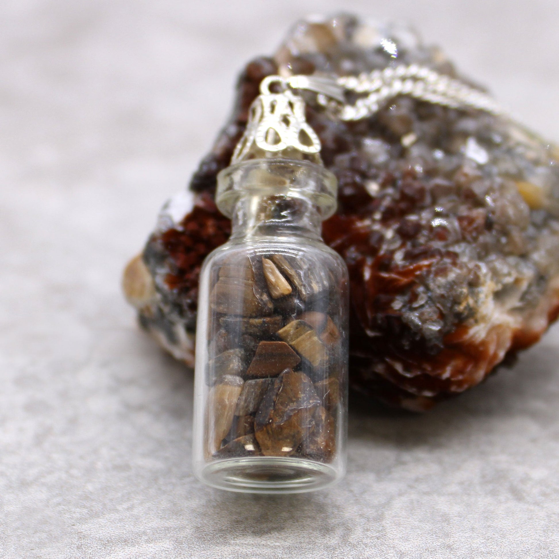 Bottled Gemstones Necklace - Amethyst product packaging on clean background from Quintessential Holistic Health Ltd