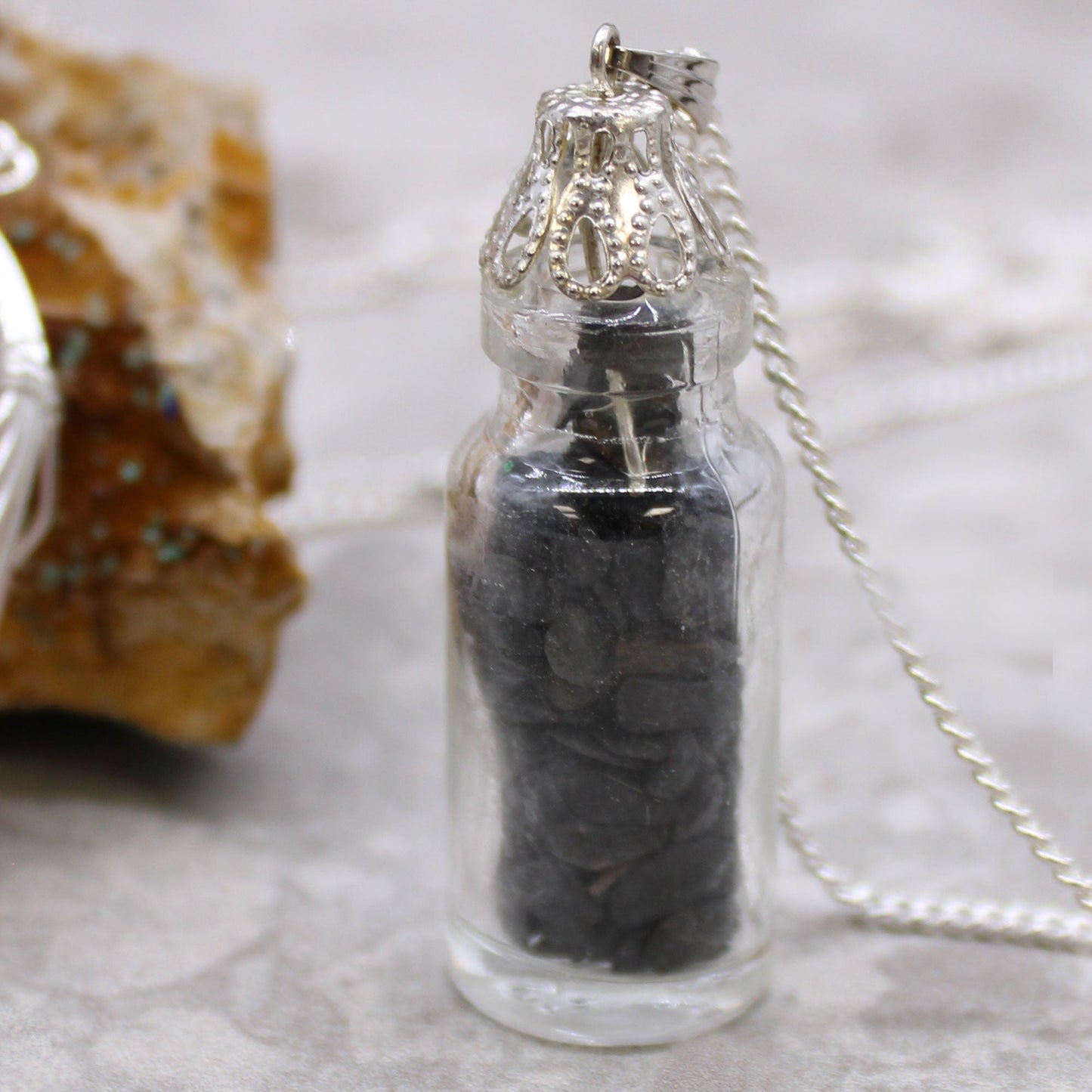 Bottled Gemstones Necklace - Black Onyx product packaging on clean background from Quintessential Holistic Health Ltd