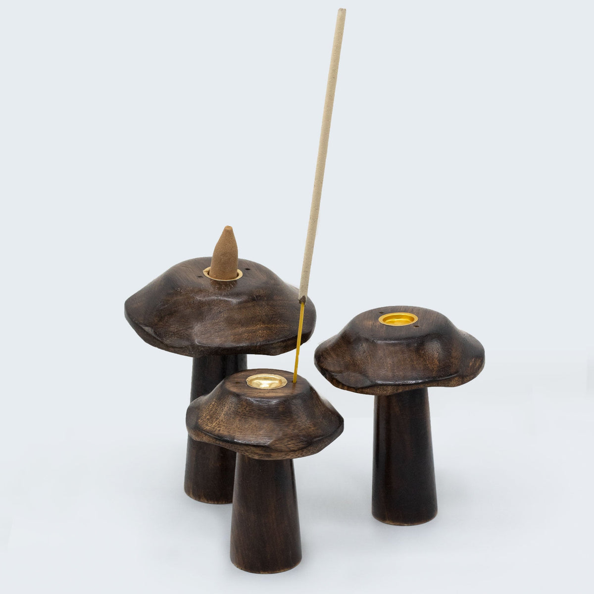 Set of 3 Mango Wood Incense Holders - Flat Mushrooms, three dark brown pieces arranged with two upright incense sticks by Quintessential Holistic Health Ltd