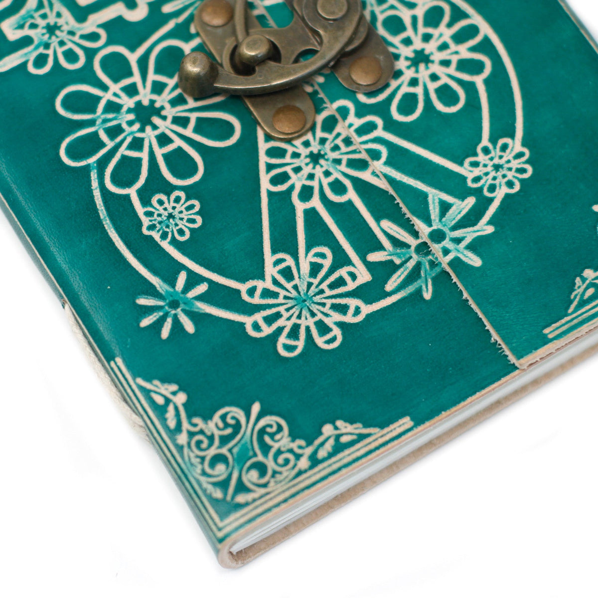 Leather-Bound Peace Notebook - Medium Green, Metal Clasp close-up showing white floral linework and ornate metal clasp by Quintessential Holistic Health Ltd