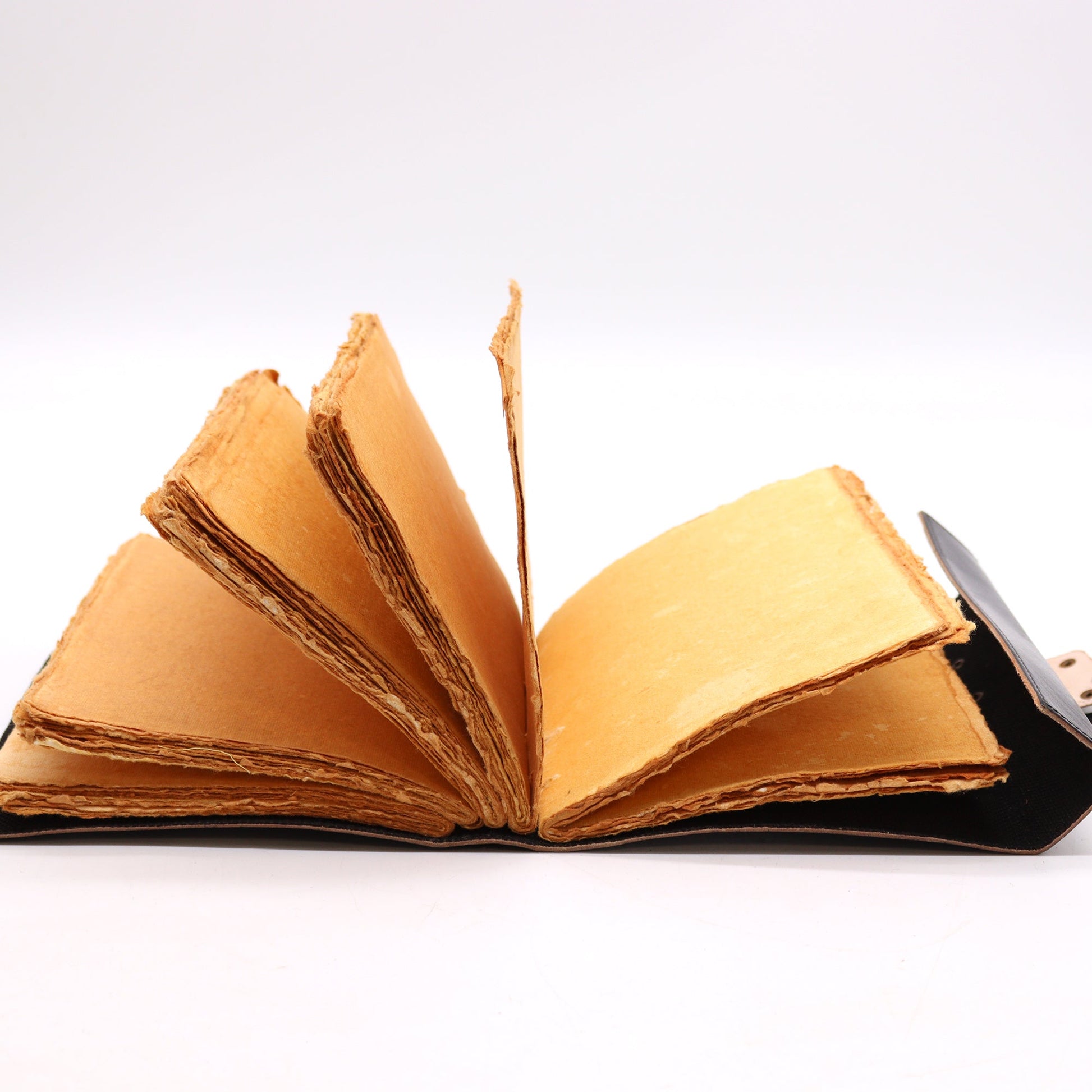 Handmade Leather-Bound Eco-Friendly Deckle Edged Notebook with Metal Clasp - Large / Black / Book of Shadows product packaging on clean background from Quintessential Holistic Health Ltd