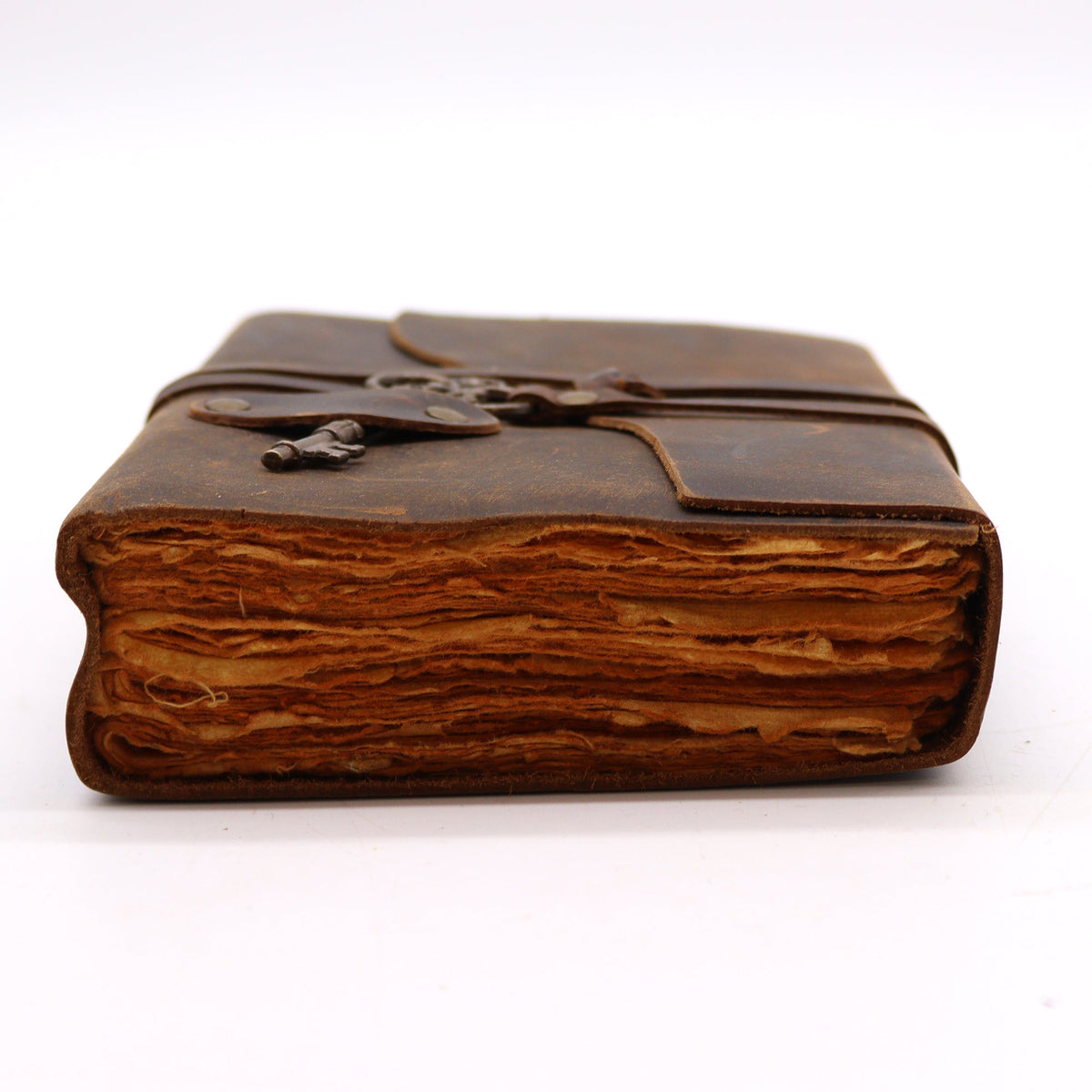 Oiled Leather 200-Page Deckle-Edged Notebook – Medium Brown shown from the page edge with layered brown pages and a cord closure by Quintessential Holistic Health Ltd