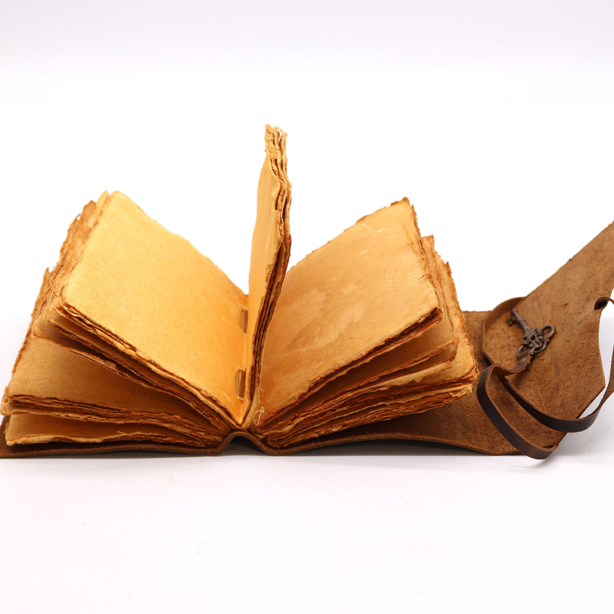 Oiled Leather 200-Page Deckle-Edged Notebook – Medium Brown open with layered tan deckle-edged pages and its cord loose by Quintessential Holistic Health Ltd