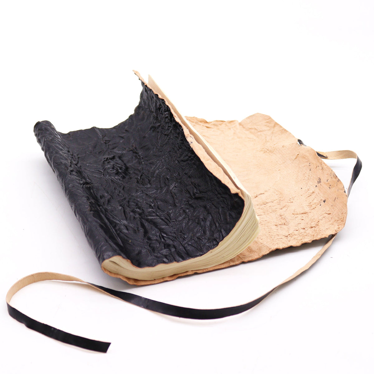 Handmade Rolled Leather Travel Notebook with Strap - Black, open with a textured black inner cover and pale outer cover by Quintessential Holistic Health Ltd