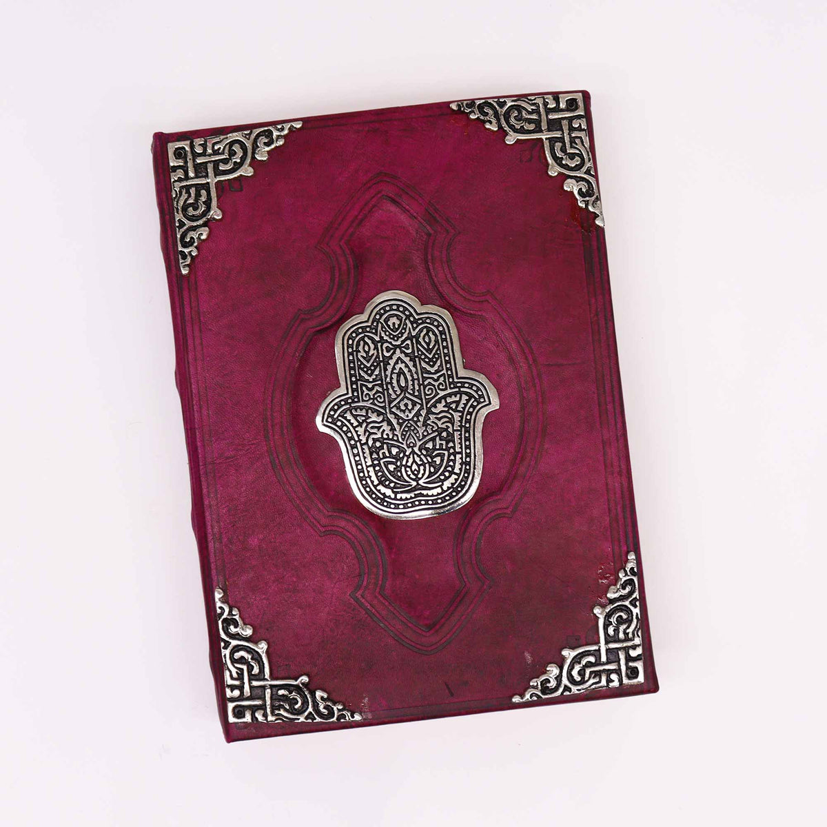 Extra-Large Burgundy Leather Deckle-Edged Journal - Zinc Hamsa, closed with central Hamsa emblem and ornate corner pieces by Quintessential Holistic Health Ltd