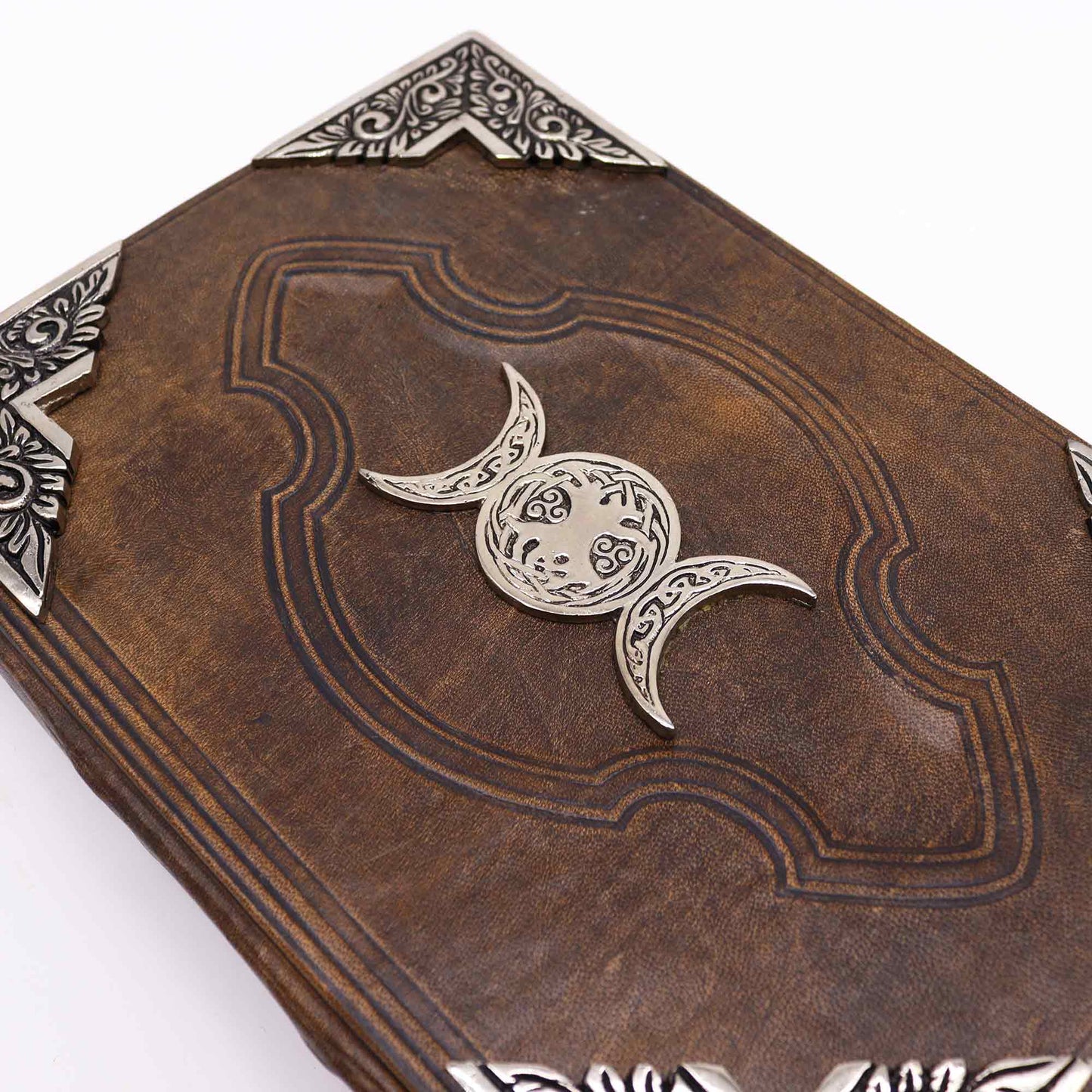 Extra-Large Brown Leather Deckle-Edged Journal - Zinc Triple Moon, close-up of brown cover with triple moon emblem and ornate corners by Quintessential Holistic Health Ltd