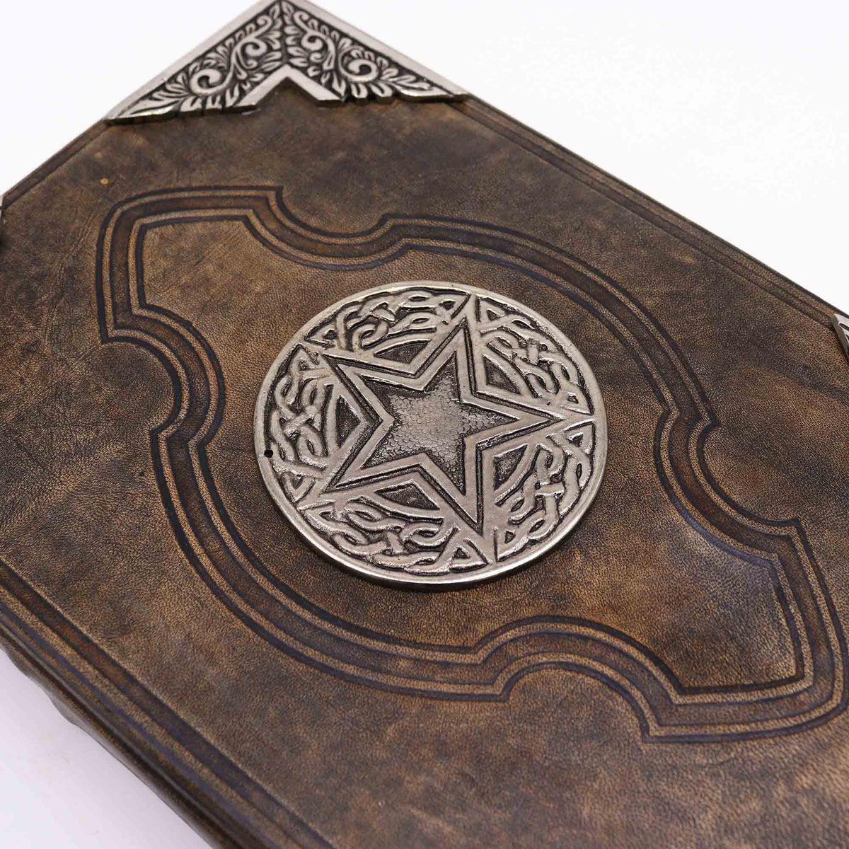 Extra-Large Brown Leather Deckle-Edged Notebook - Zinc Pentagon with a close view of the star medallion and ornate corner fitting by Quintessential Holistic Health Ltd