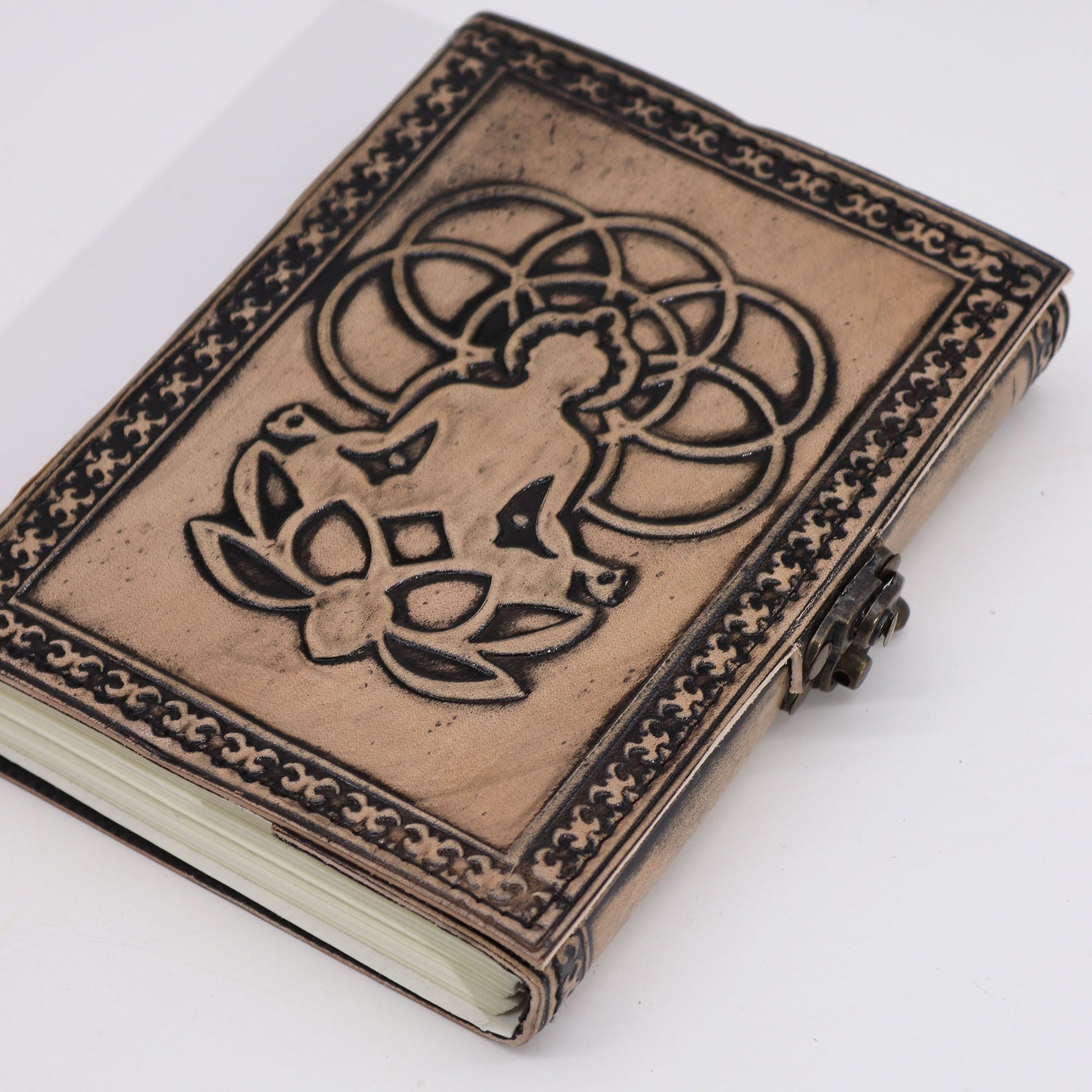 Medium Leather Notebook - Antique Grey & Tan - Buddha - 200 Pages, angled view of the raised Buddha design and patterned edging, by Quintessential Holistic Health Ltd