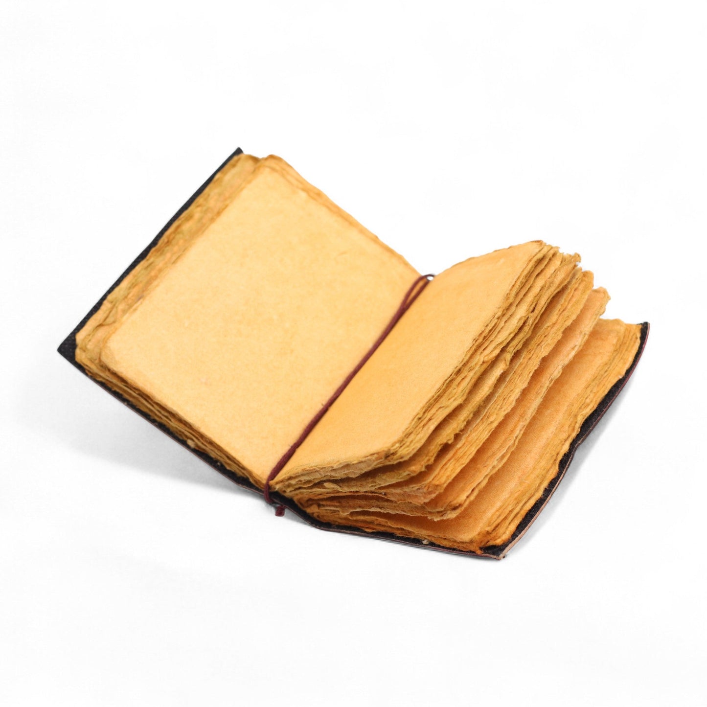 Small Brown Deckle-Edged Leather Wrap Journal - Good in Every Day open to blank golden deckle-edged pages by Quintessential Holistic Health Ltd