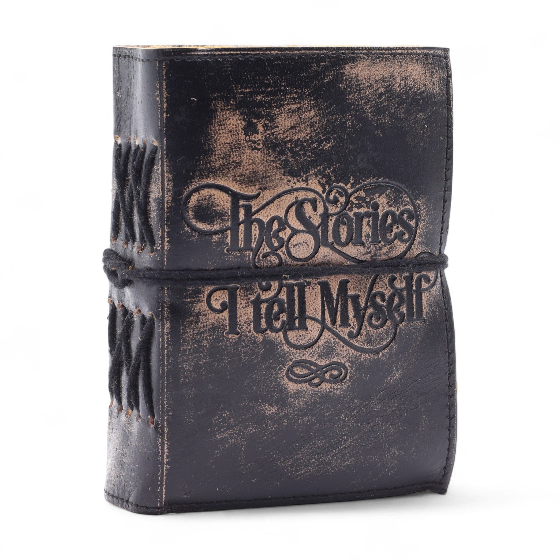 Small Black and Tan Leather Journal - The Stories I Tell Myself with ornate cover lettering and a black wrap cord by Quintessential Holistic Health Ltd