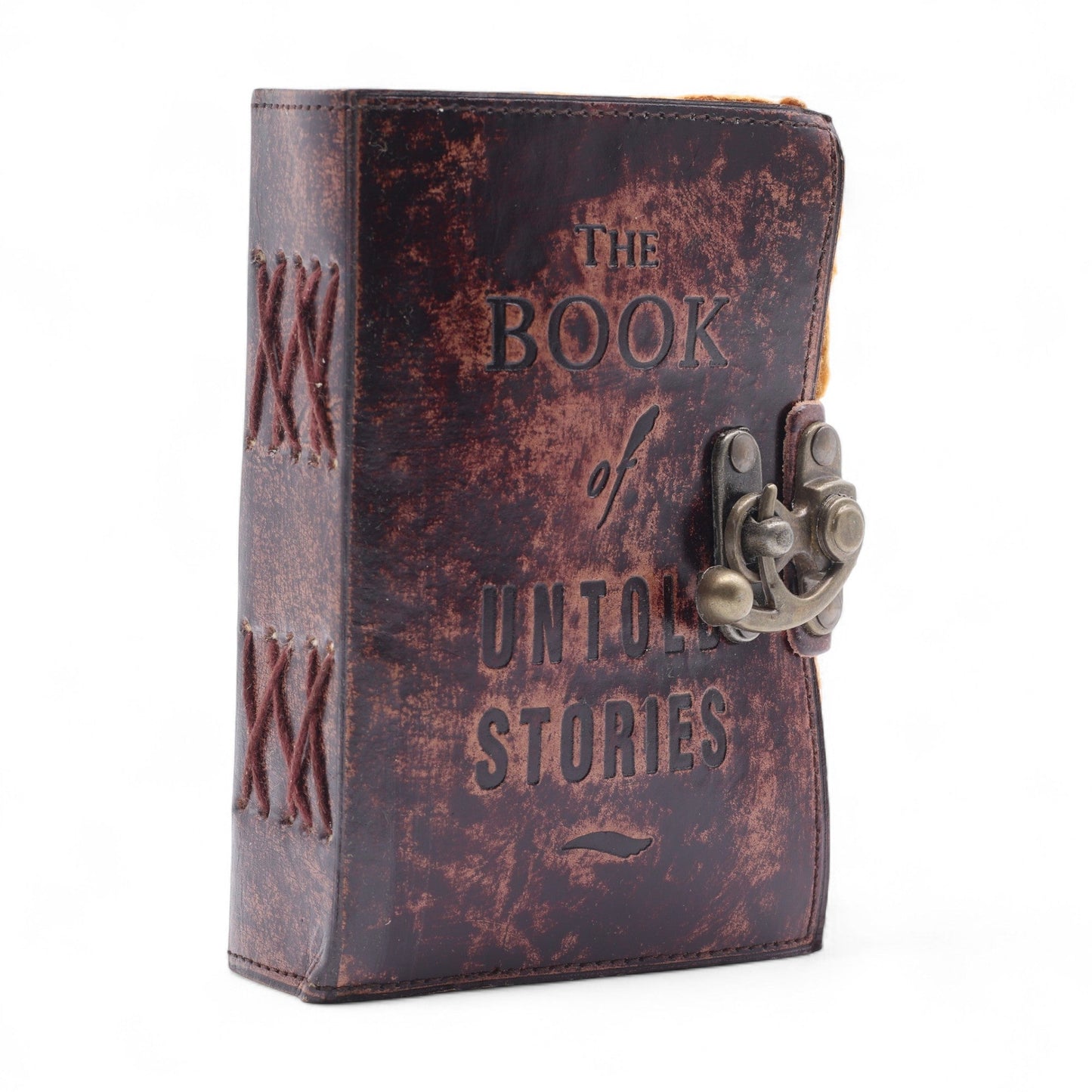 Small Brown Leather Journal - The Book of Untold Stories, standing closed with embossed cover lettering and an ornate metal clasp by Quintessential Holistic Health Ltd