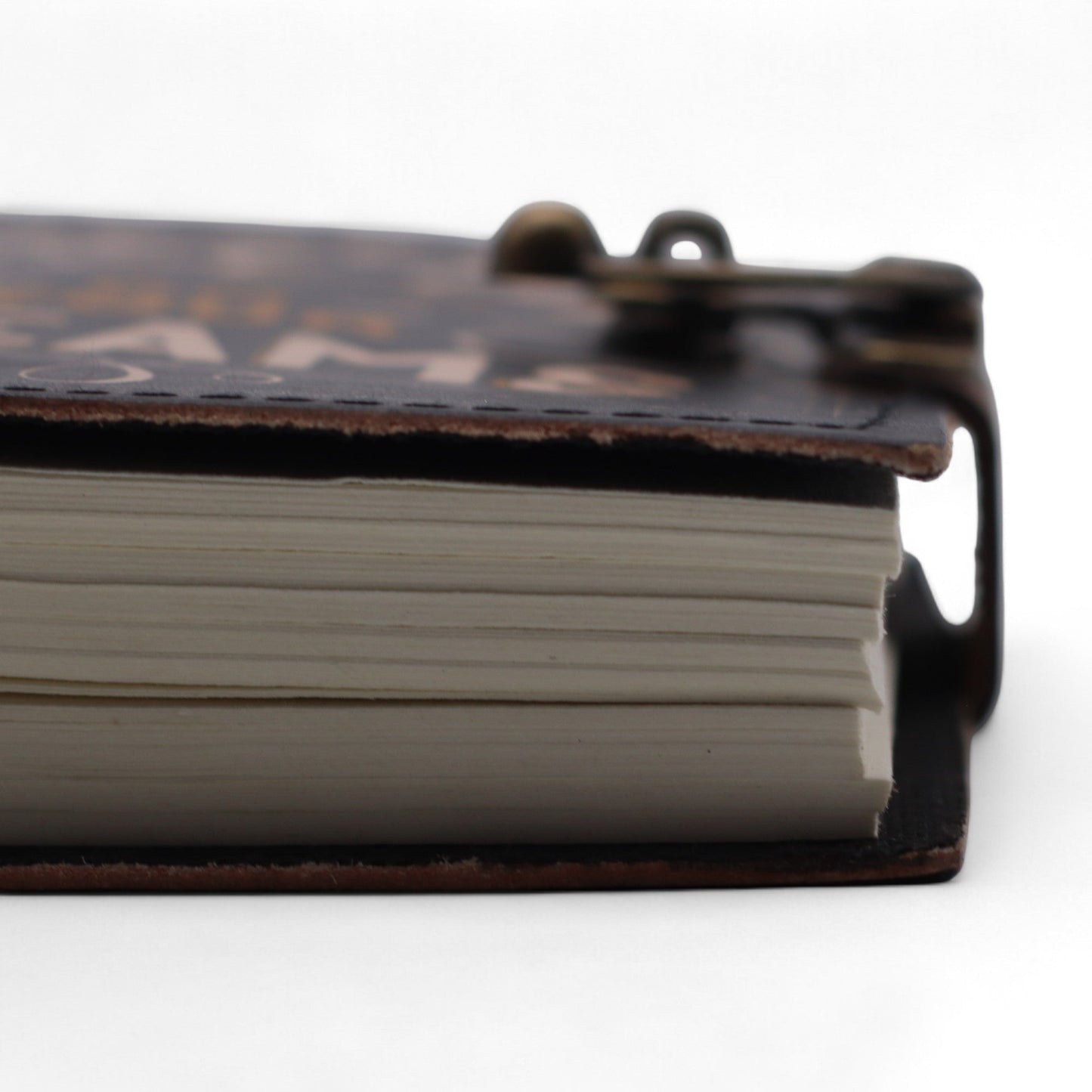Handmade Leather-Bound Eco-Friendly Journal with Metal Clasp – Medium / Black / Never Give Up On Your Dreams product packaging on clean background from Quintessential Holistic Health Ltd