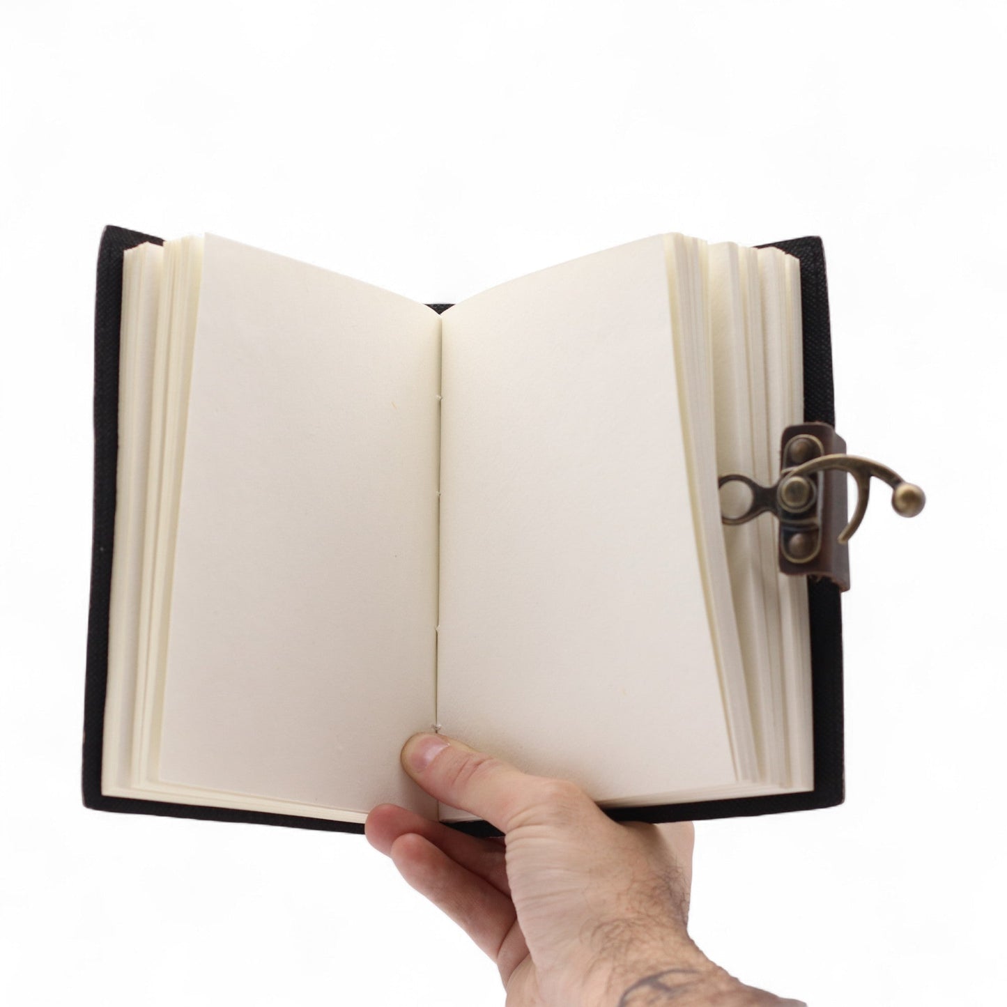 Handmade Leather-Bound Eco-Friendly Journal with Metal Clasp – Medium / Black / Never Give Up On Your Dreams product packaging on clean background from Quintessential Holistic Health Ltd