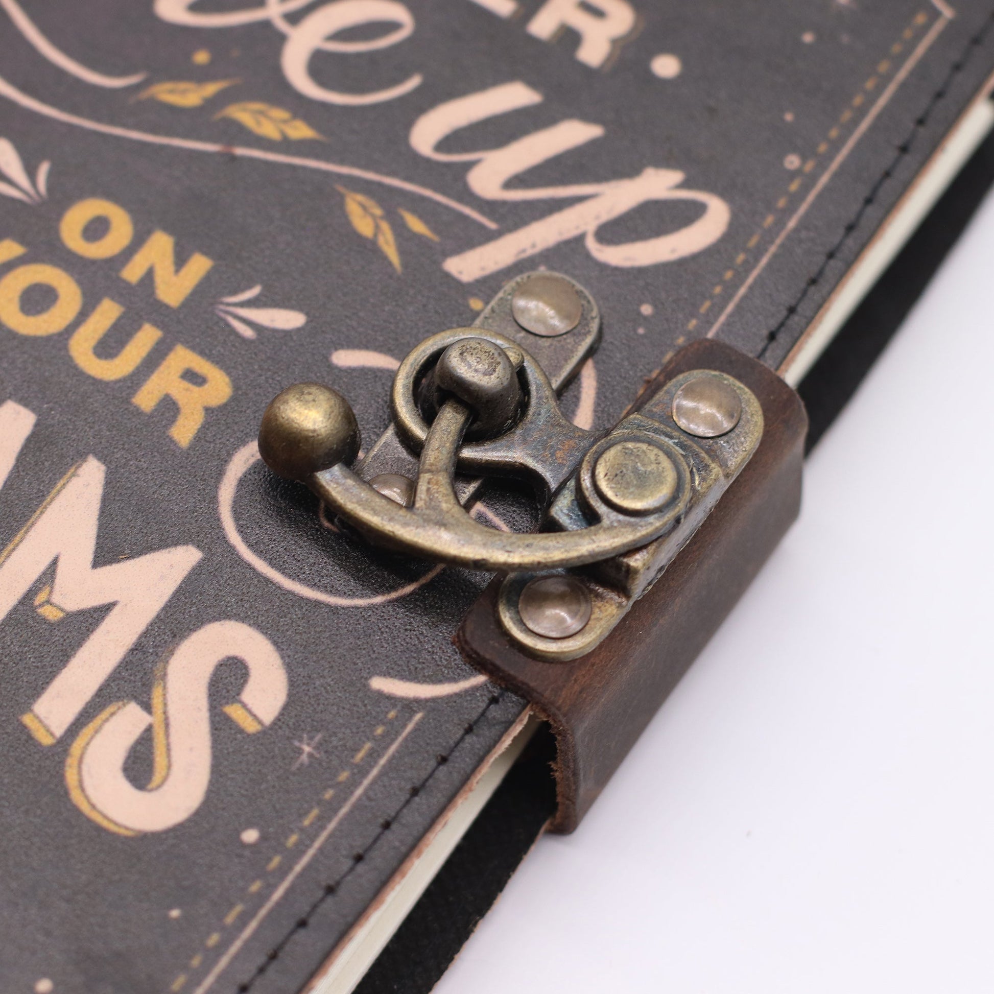 Handmade Leather-Bound Eco-Friendly Journal with Metal Clasp – Medium / Black / Never Give Up On Your Dreams product packaging on clean background from Quintessential Holistic Health Ltd
